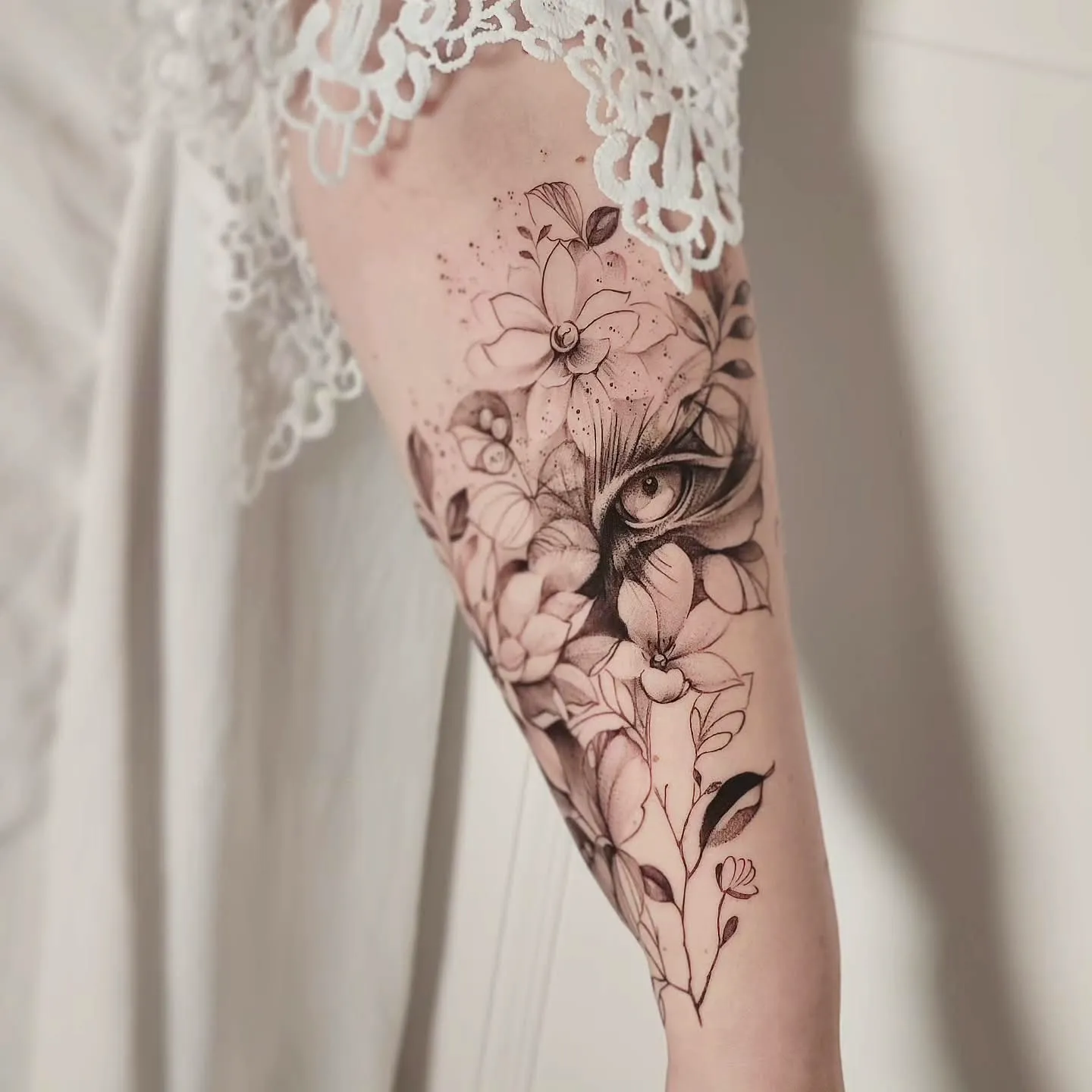 Intricate Tiger Eye Floral Tattoo on the Forearm