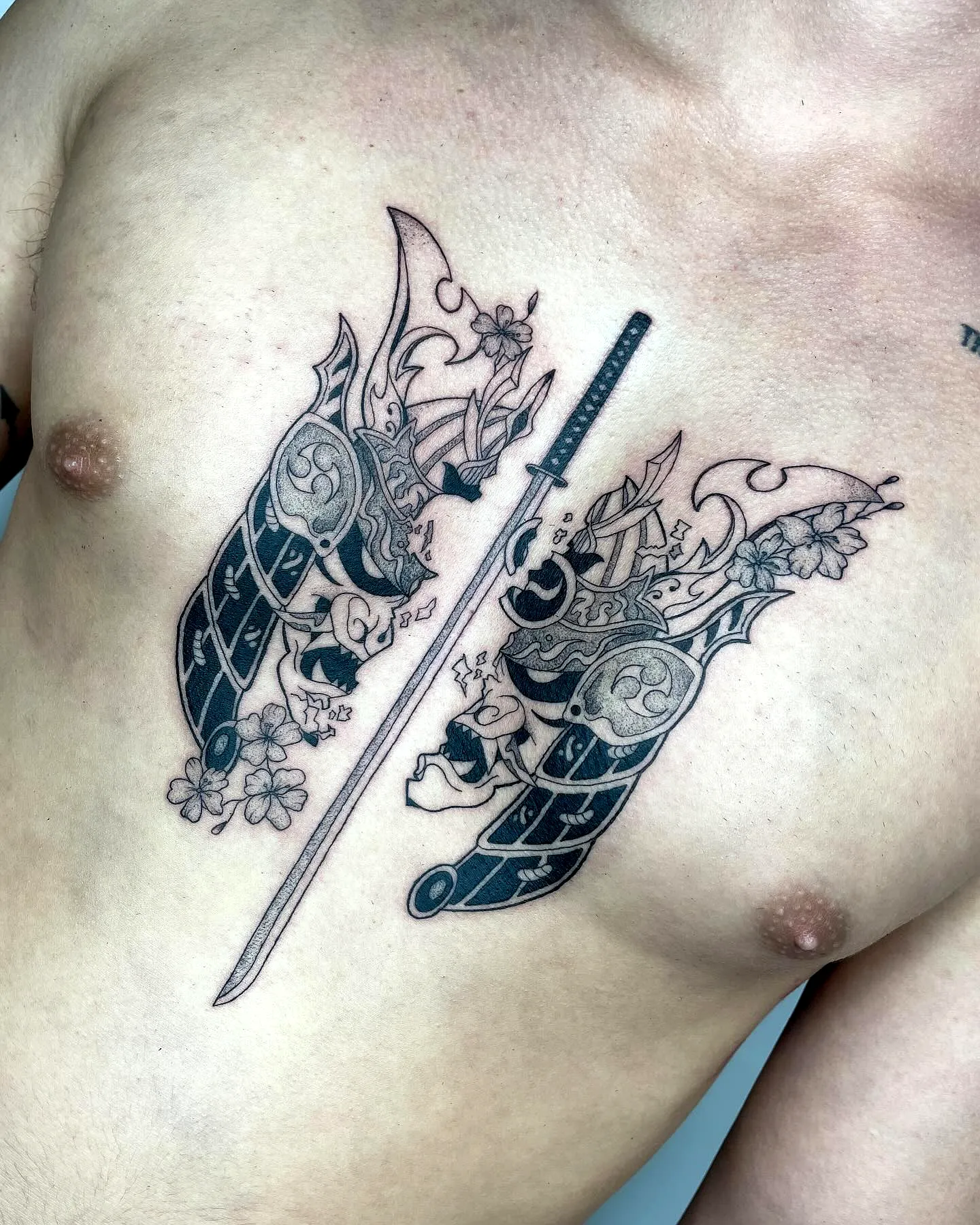 Ornate Samurai Mask Tattoo on Chest with Katana and Floral Motifs