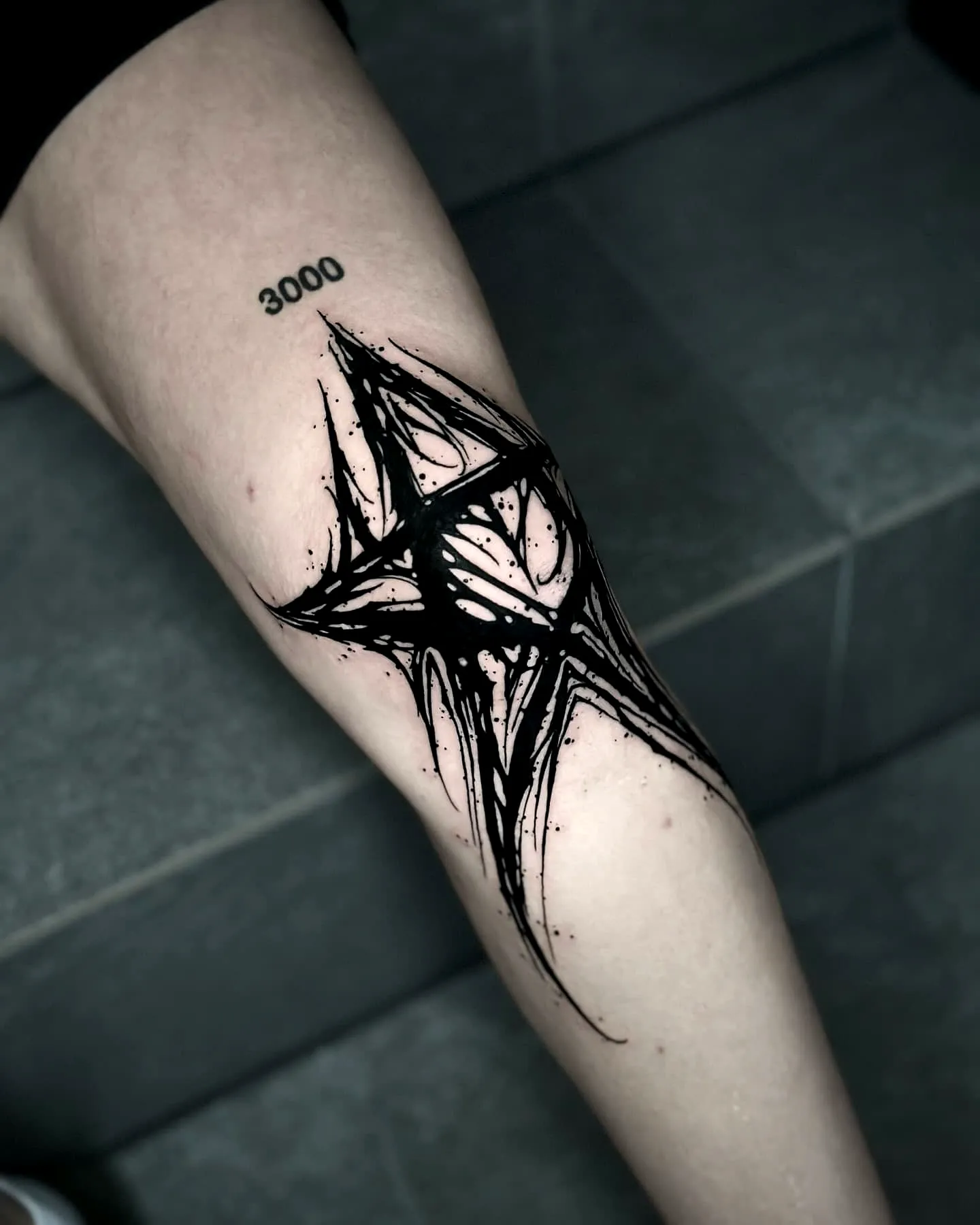 Abstract Black Ink Lower Leg Tattoo
