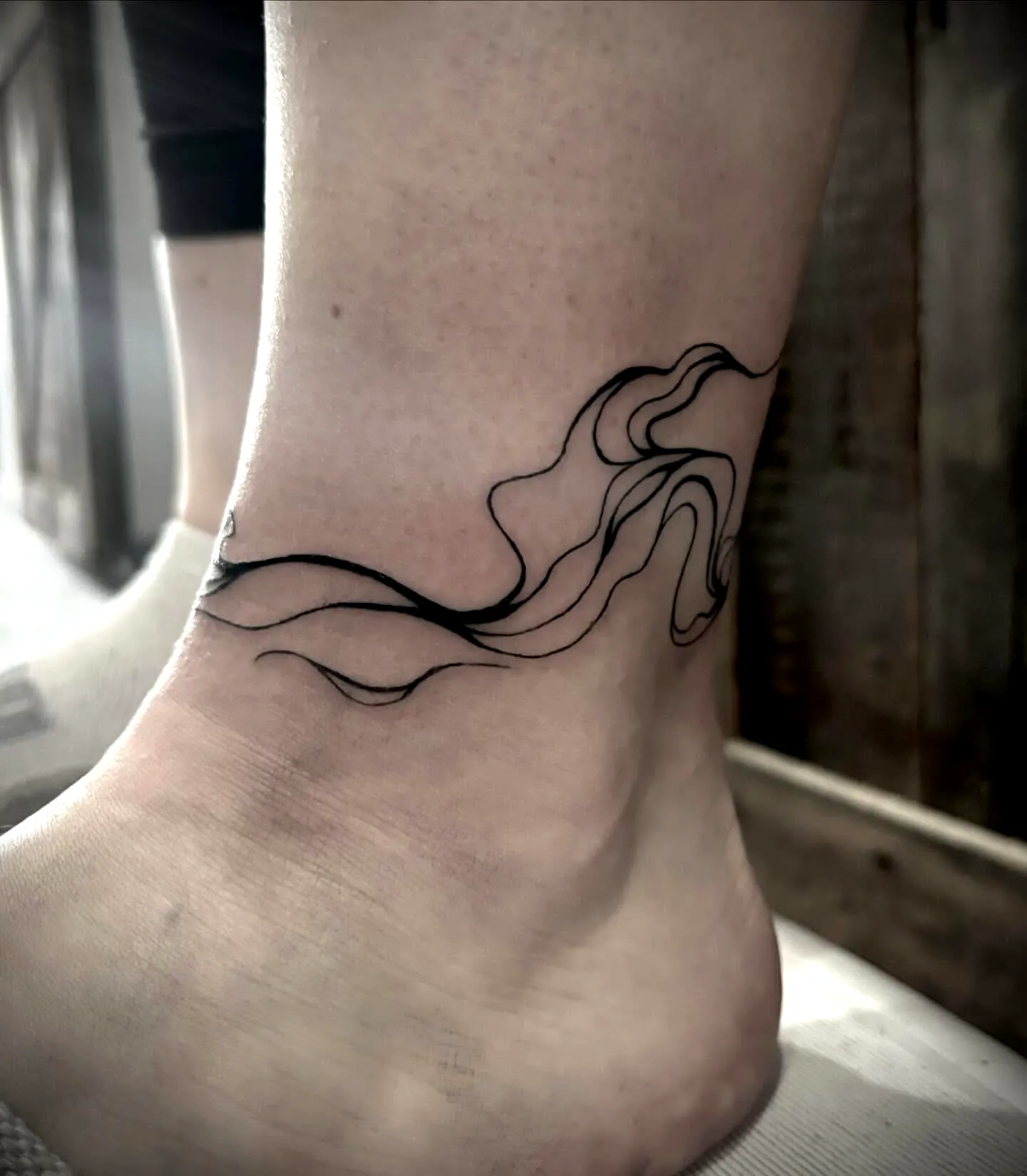 Abstract Black Line Art Ankle Tattoo
