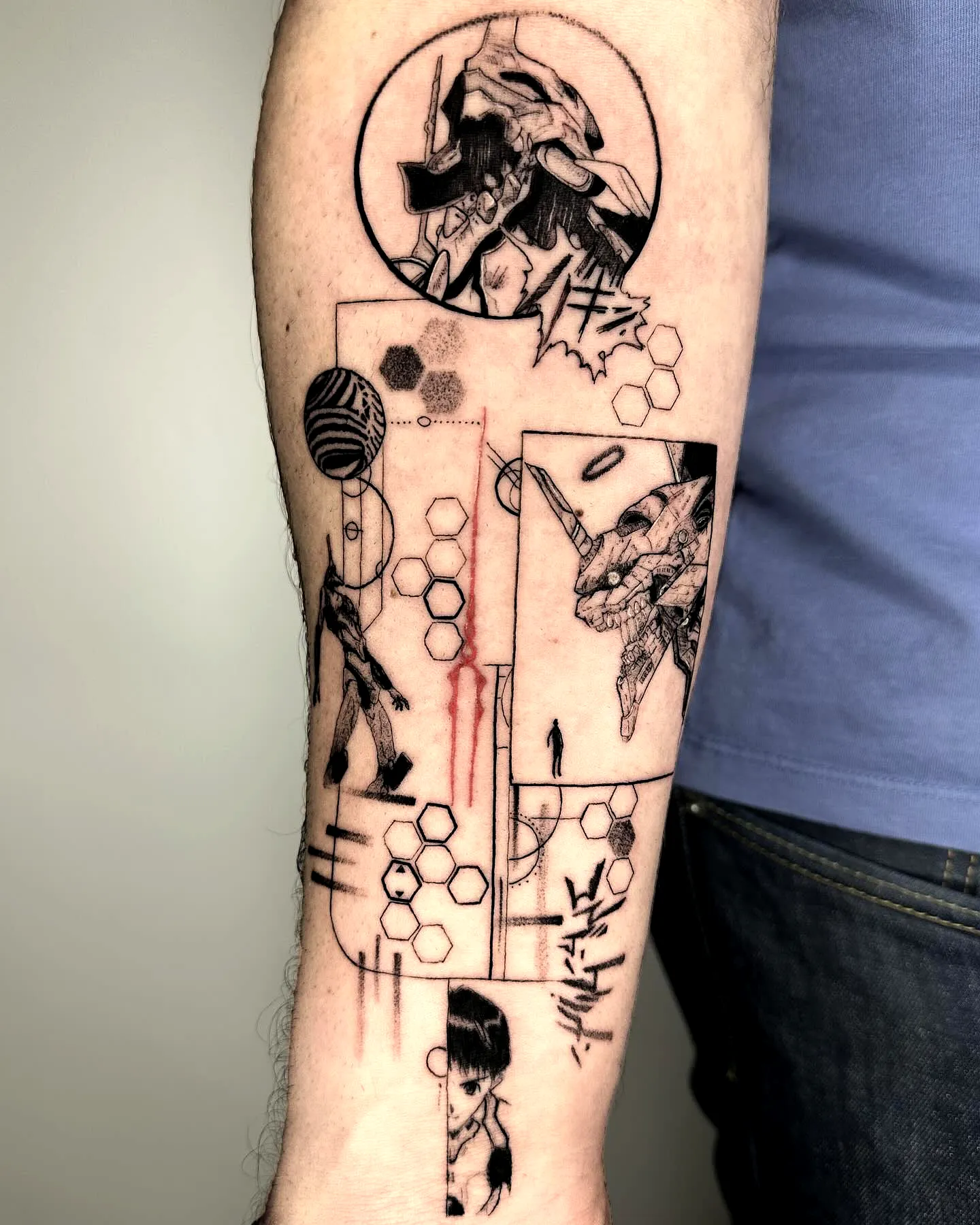 Abstract humanoid forearm tattoo