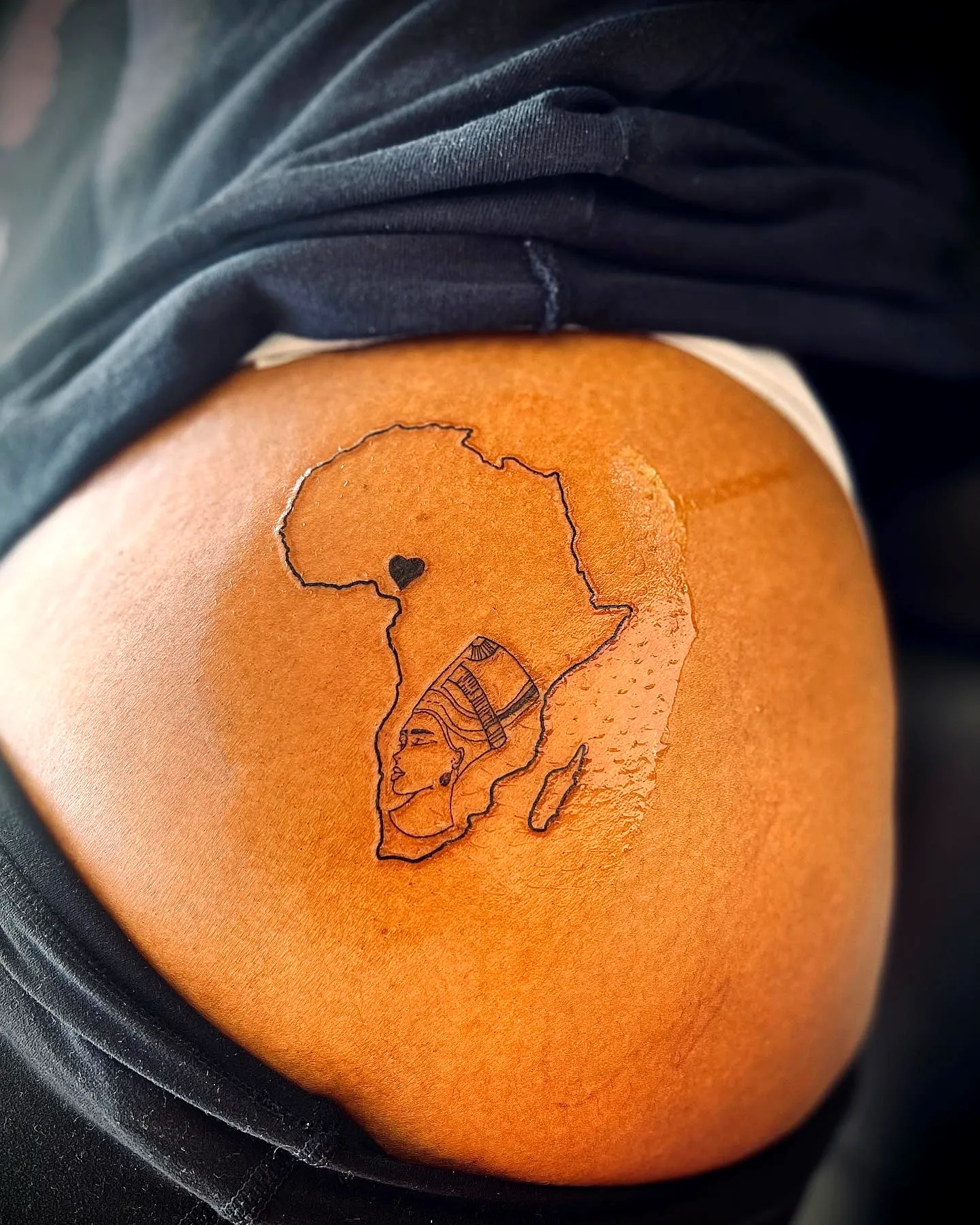 African Continent Lower Back Tattoo