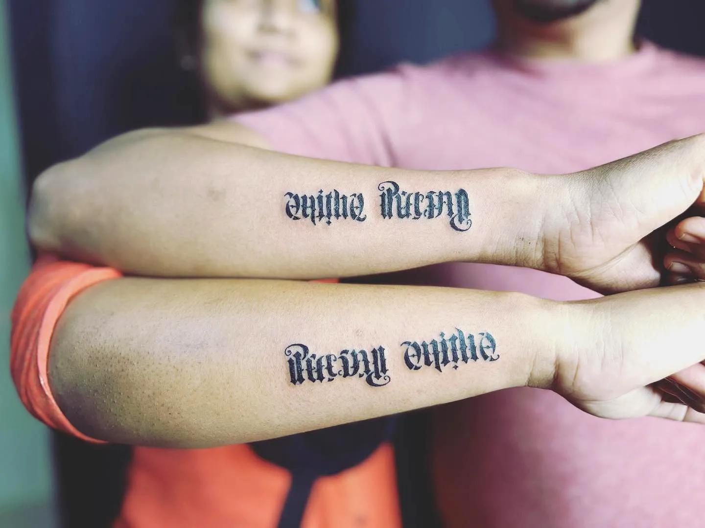 Ambigram Forearm Tattoo in Bold Black