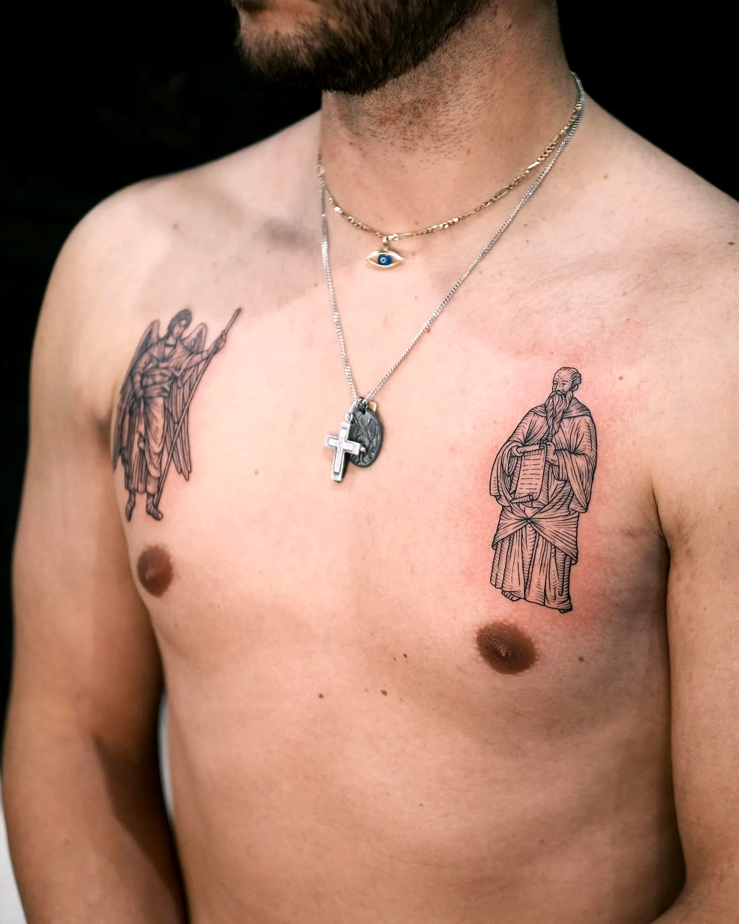 Angel and Sage Chest Tattoos in Black Ink