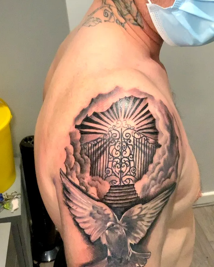 Angel Upper Arm Tattoo in Black and Gray