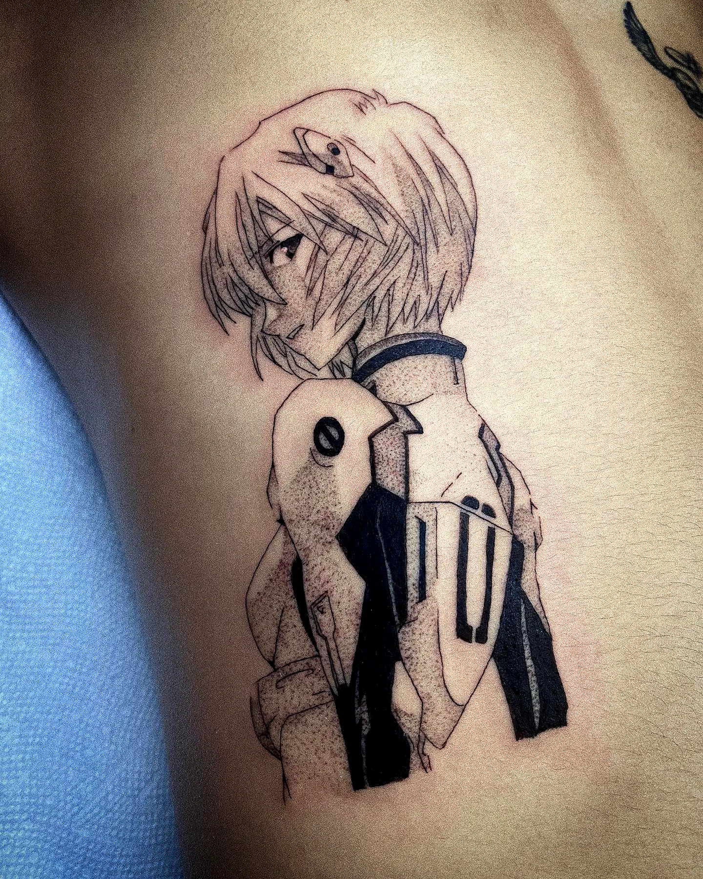 Anime character torso tattoo