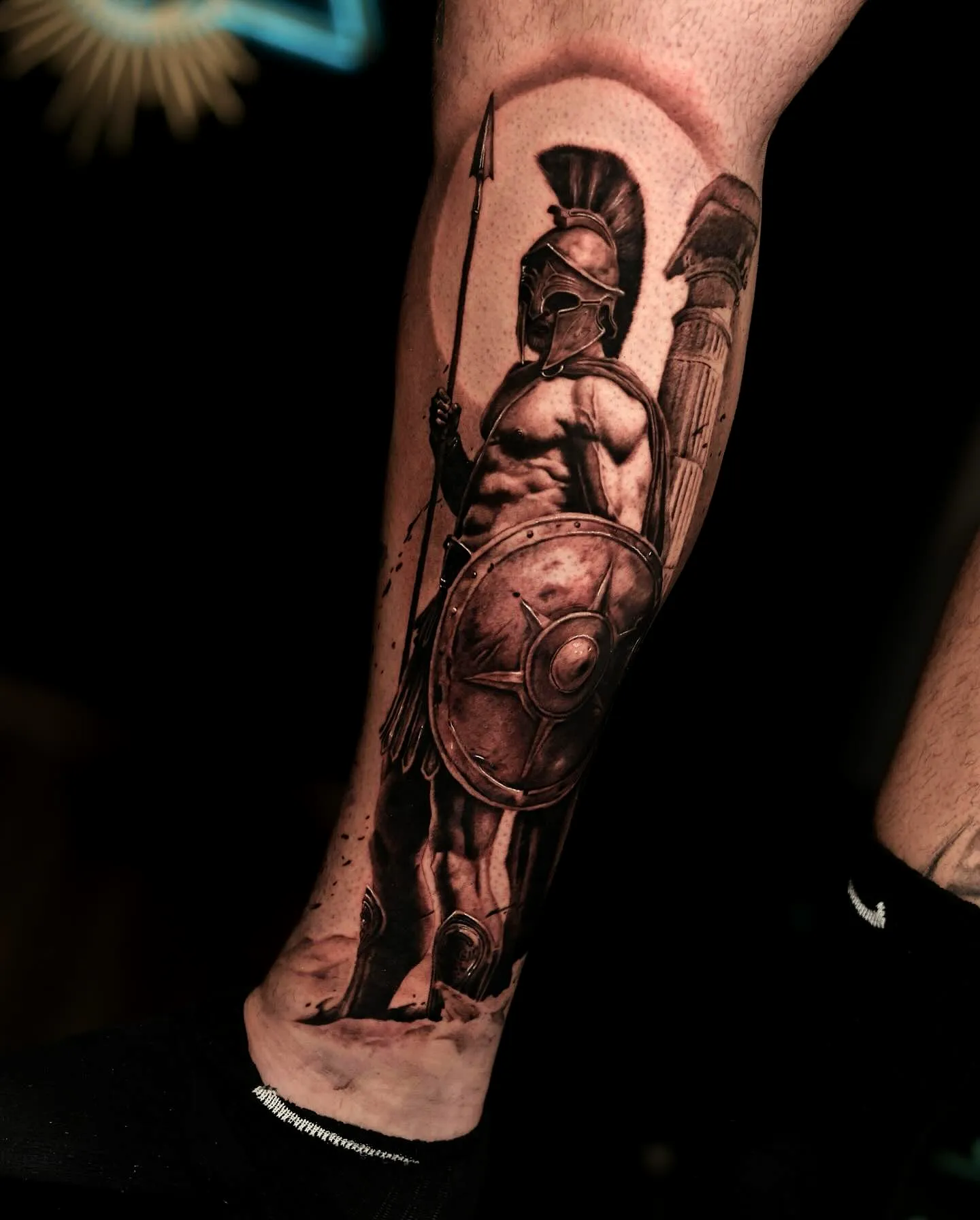 Ares Black and Gray Lower Leg Tattoo