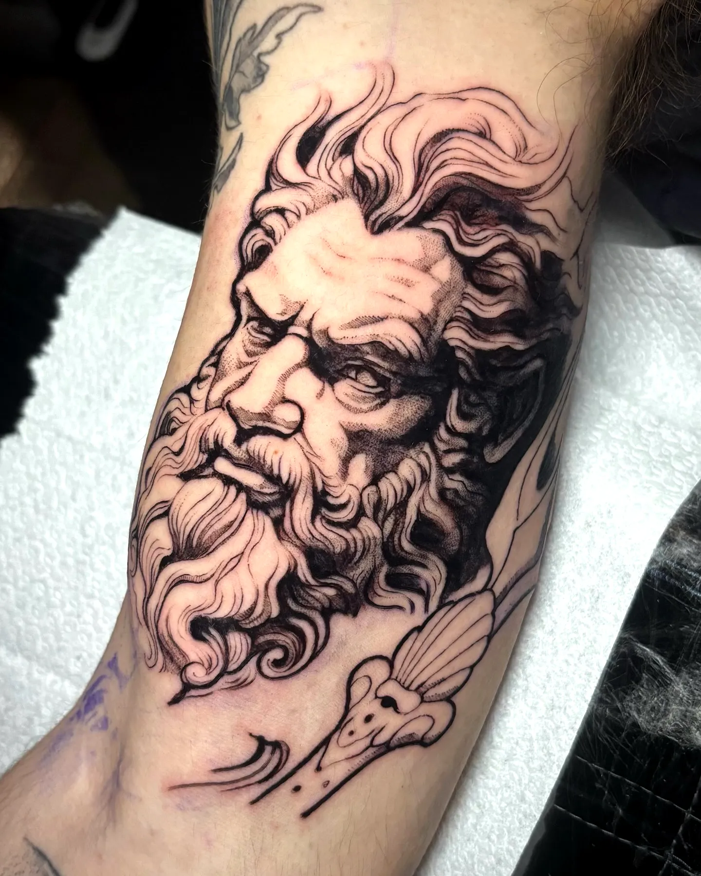 Bearded Deity Forearm Tattoo in Black and Gray