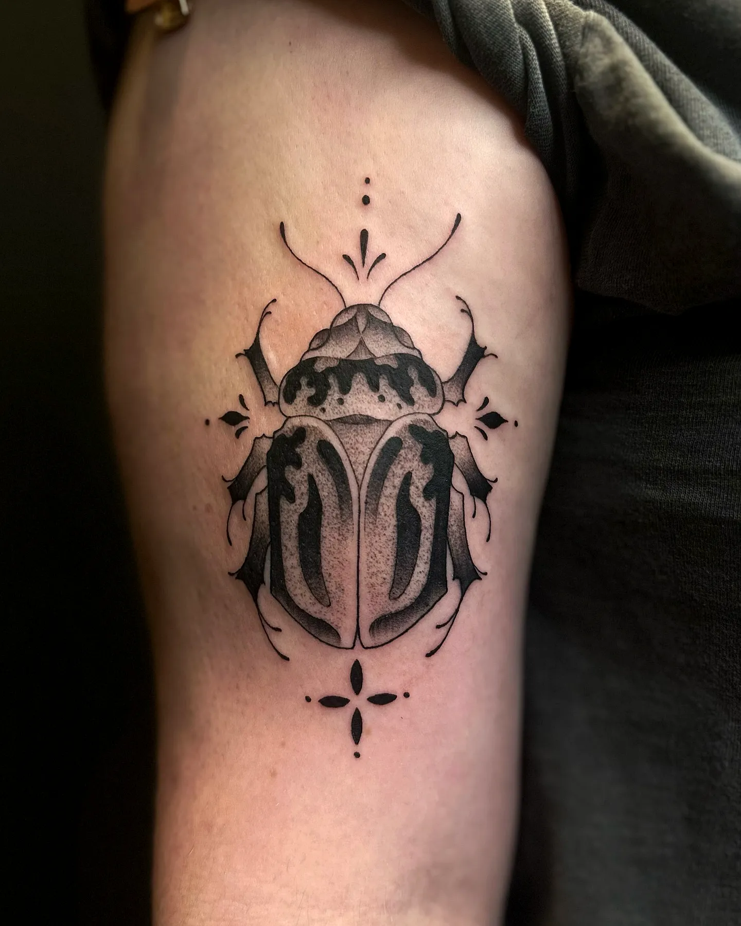 Beetle Upper Arm Tattoo with Geometric Elements