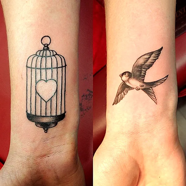 Birdcage Heart Arm Tattoo Design