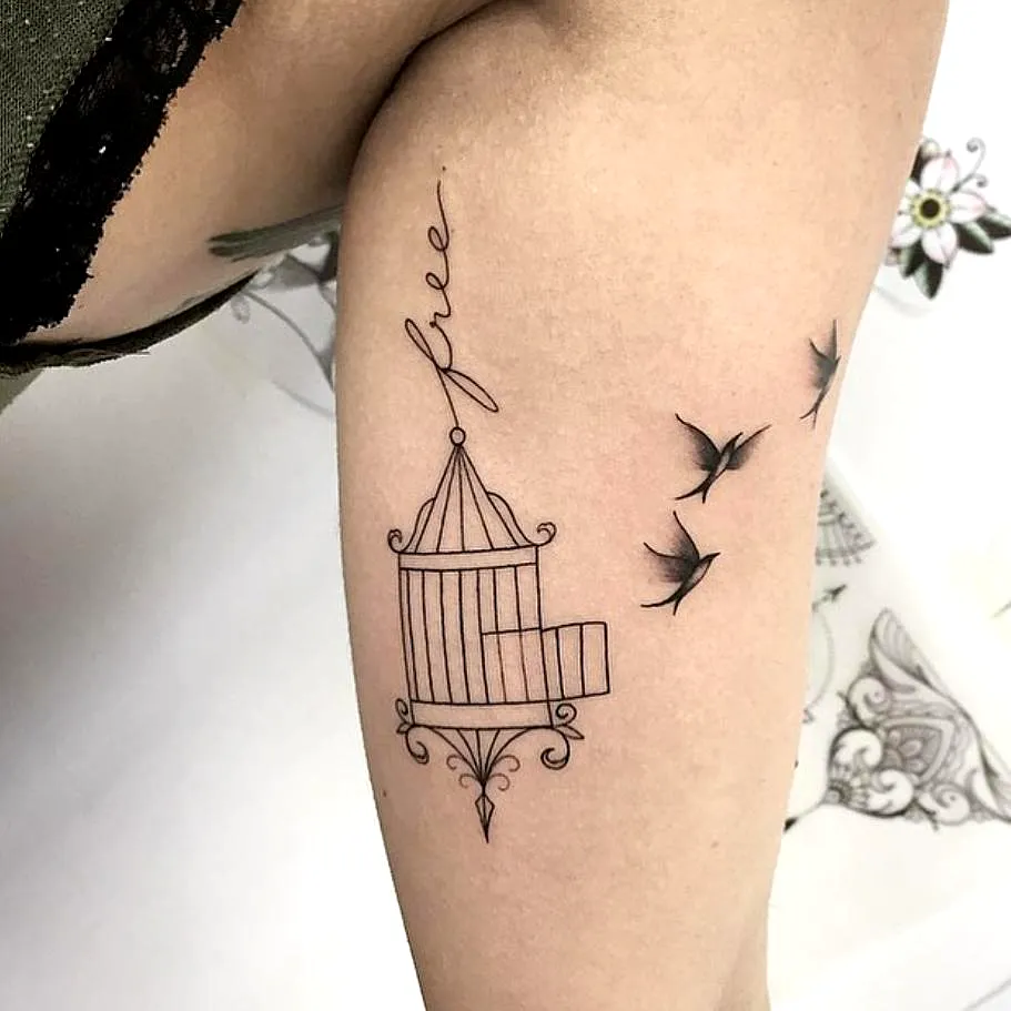 Birdcage Upper Arm Tattoo in Black Ink