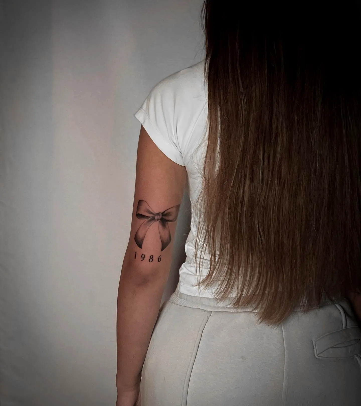 Black Bow Upper Arm Tattoo 1986