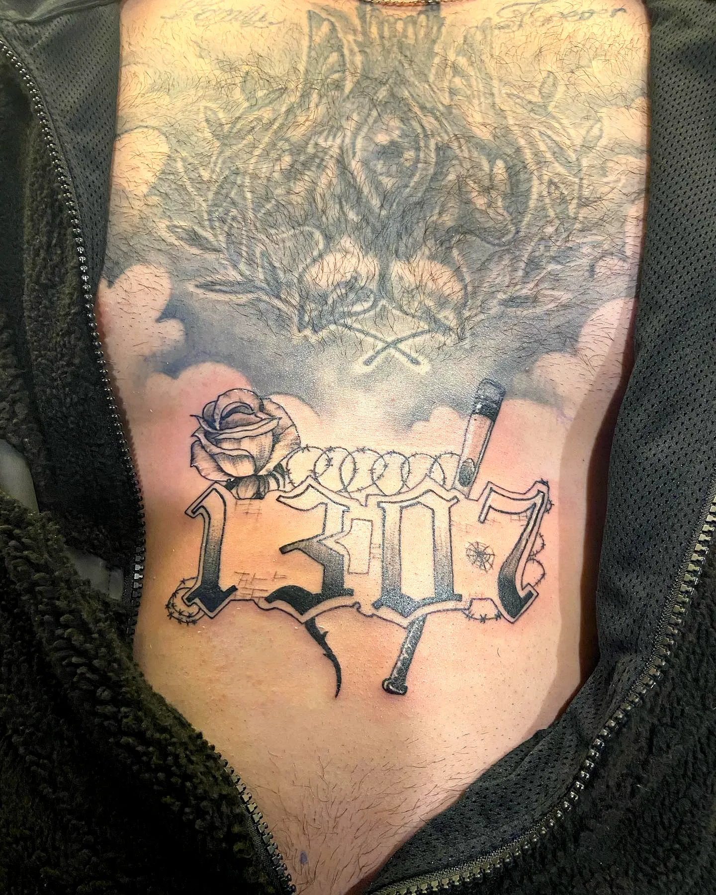 Bold 1307 Chest Tattoo with Rose and Pen