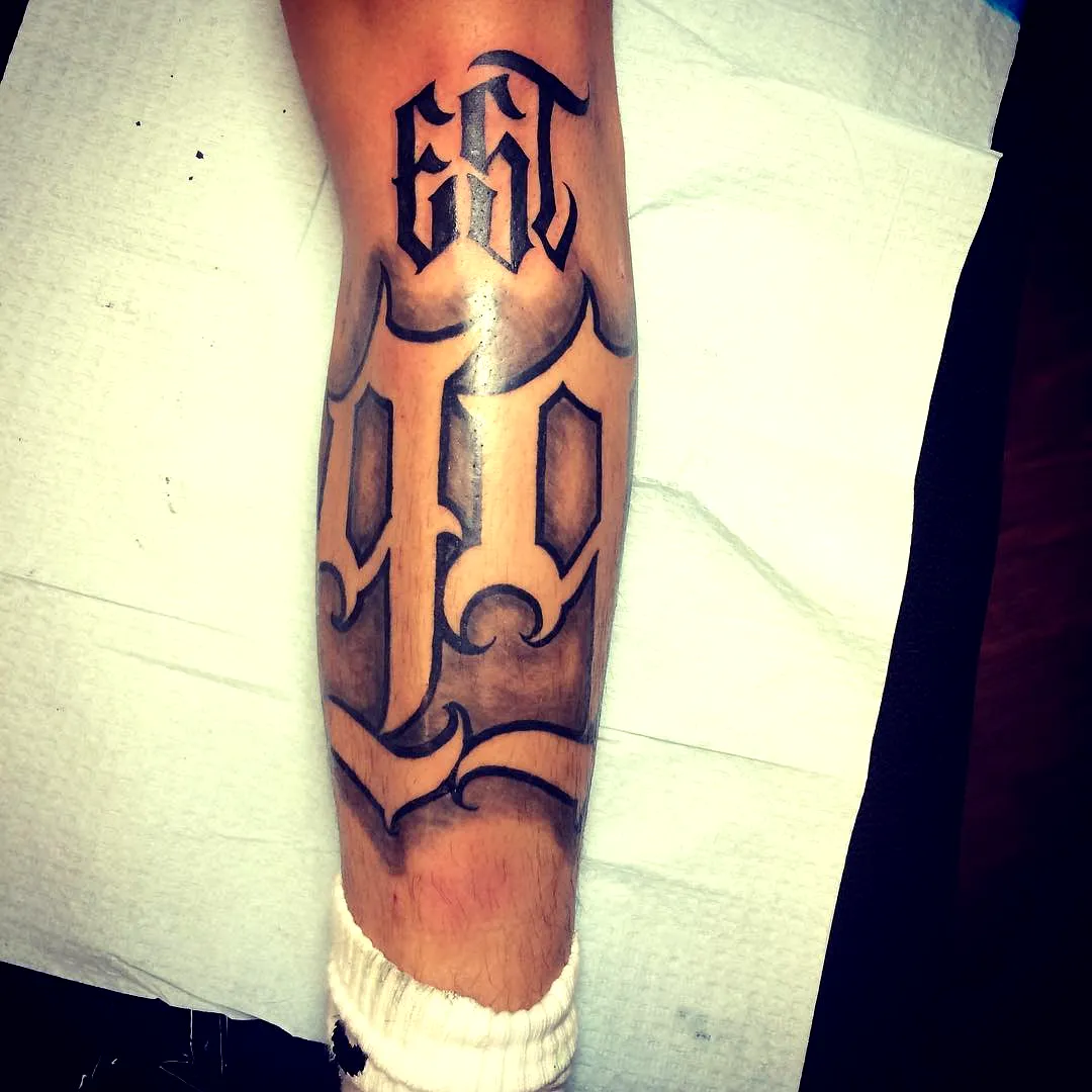 Bold Black Ink Leg Tattoo Design