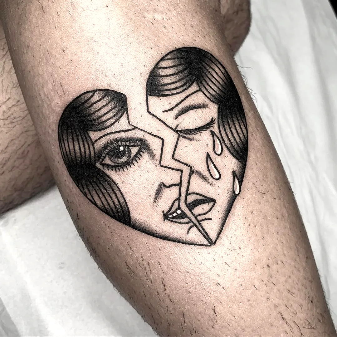 Bold Broken Heart Arm Tattoo