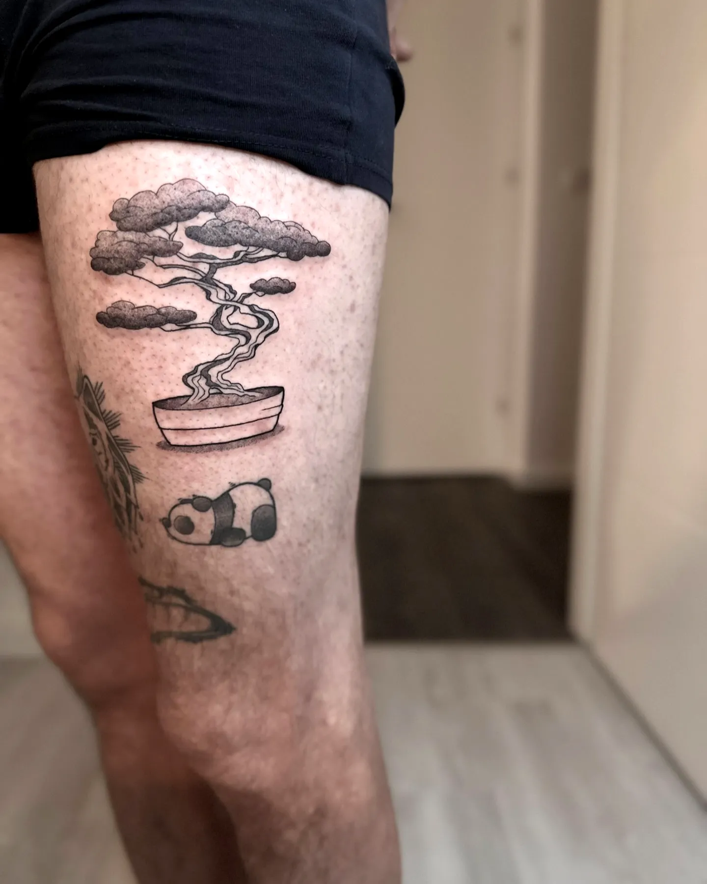 Bonsai Tree Thigh Tattoo with Clouds