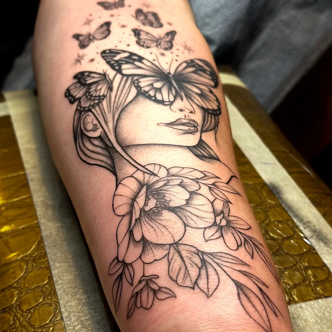 Butterfly Face Floral Tattoo
