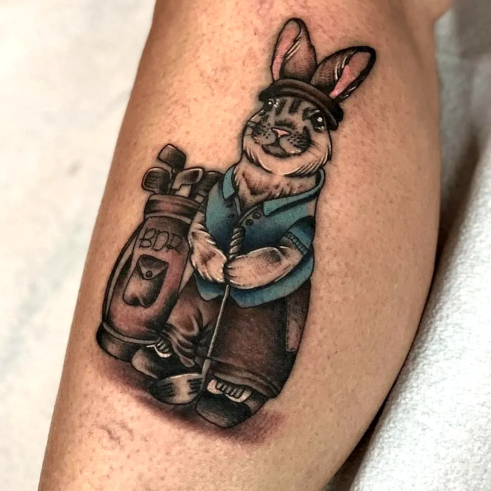 Cartoon Rabbit Leg Tattoo with Golf Bag