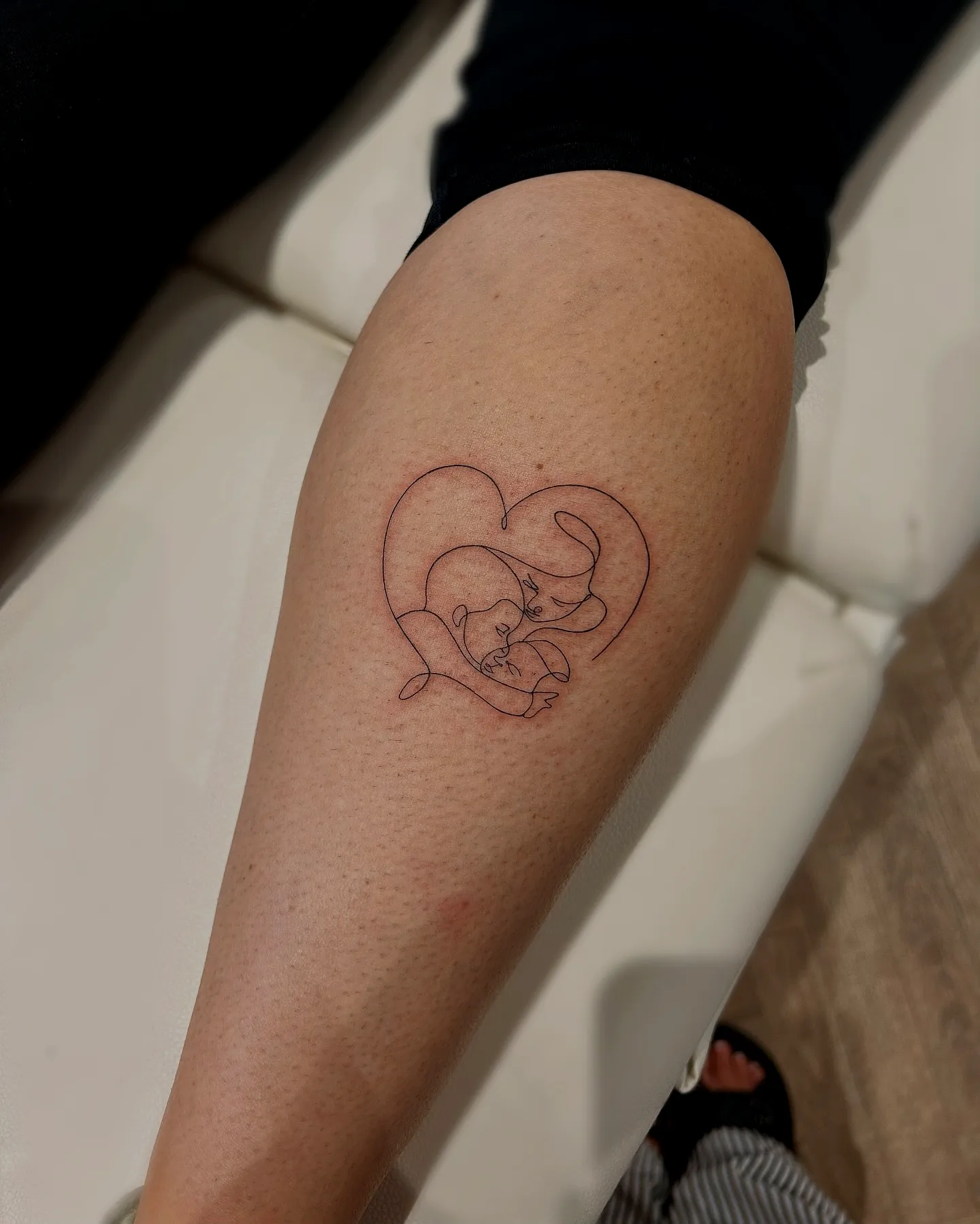 Cat Forearm Tattoo in Minimalist Style