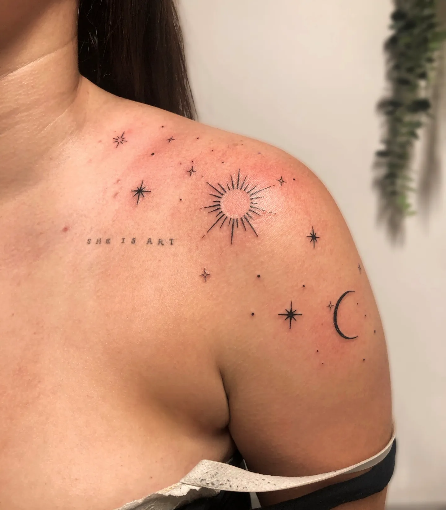 Celestial Shoulder Tattoo in Black Ink