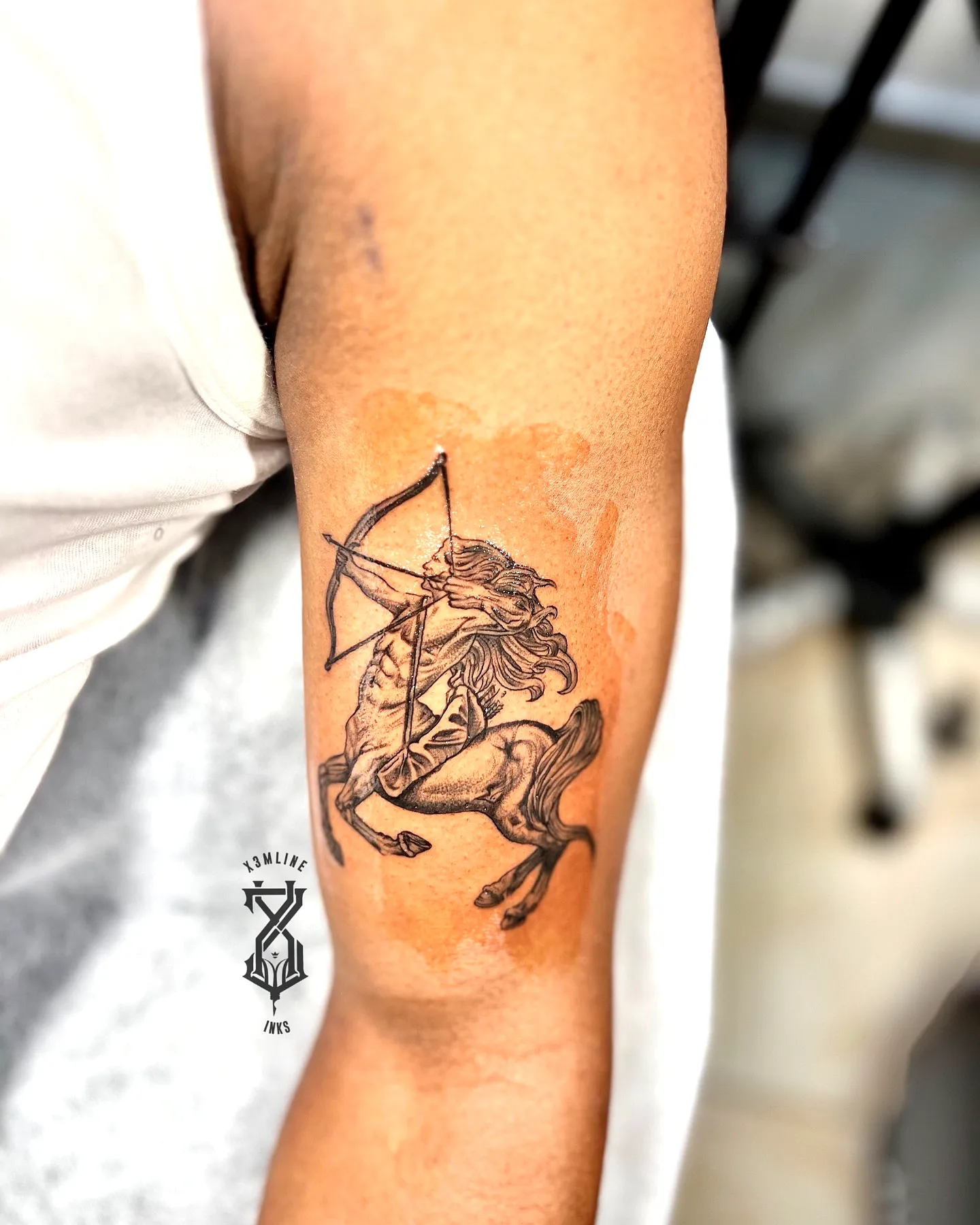 Centaurs Forearm Tattoo in Black and Gray