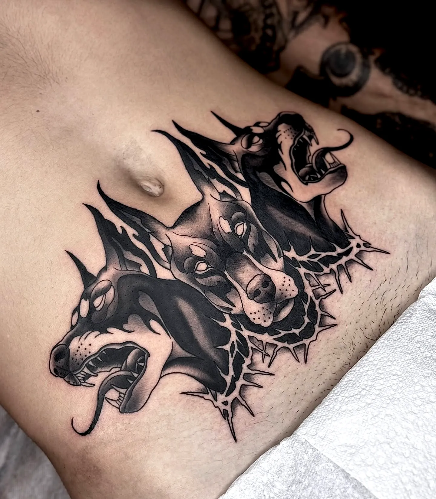 Cerberus Torso Tattoo in Black Ink