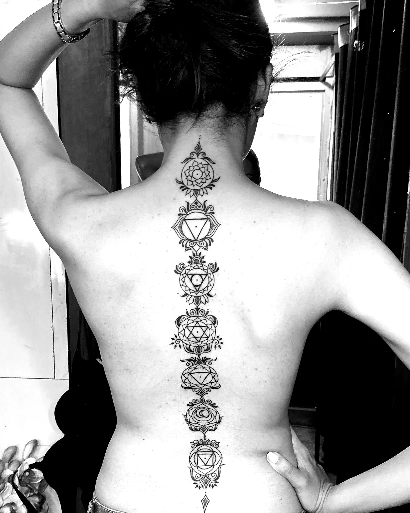 Chakra Spine Tattoo with Intricate Line Work