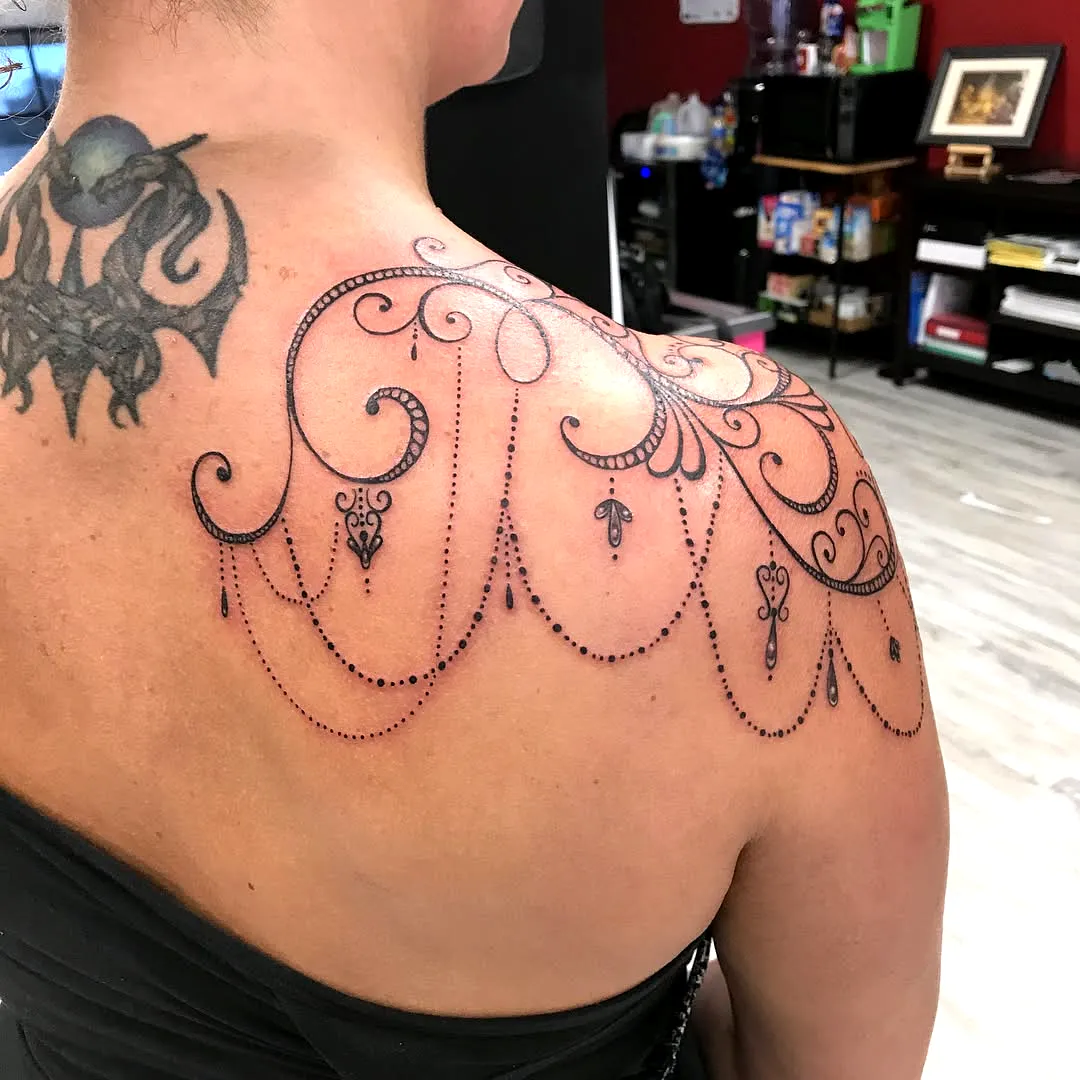 Chandelier Lace Upper Back Tattoo