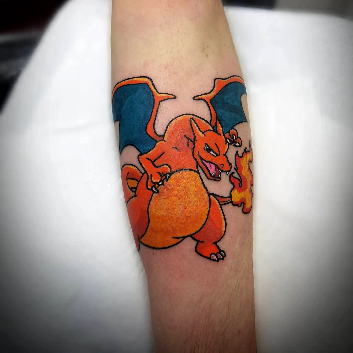 Charizard Forearm Tattoo in Vibrant Colors