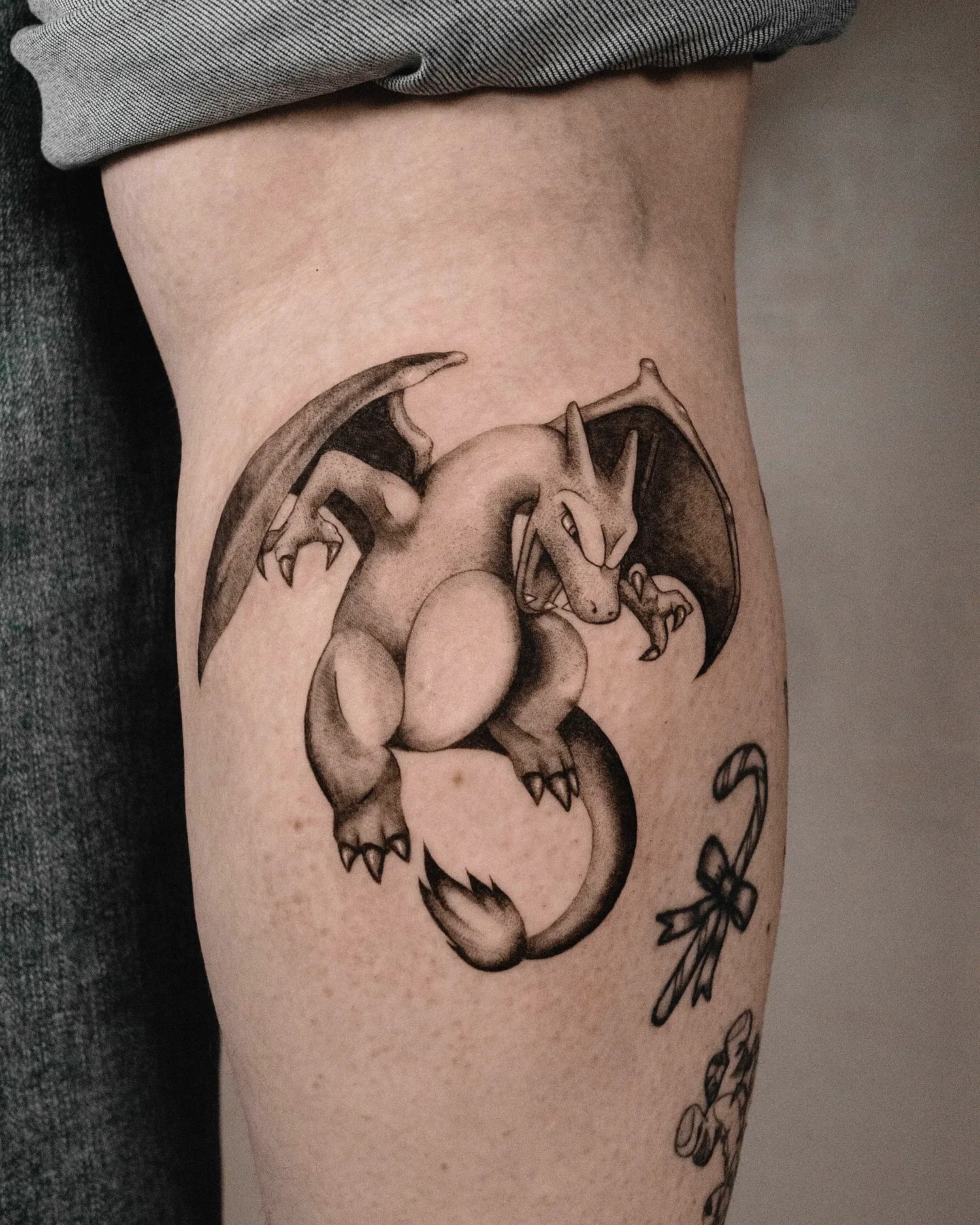 Charizard Thigh Tattoo in Black and Gray