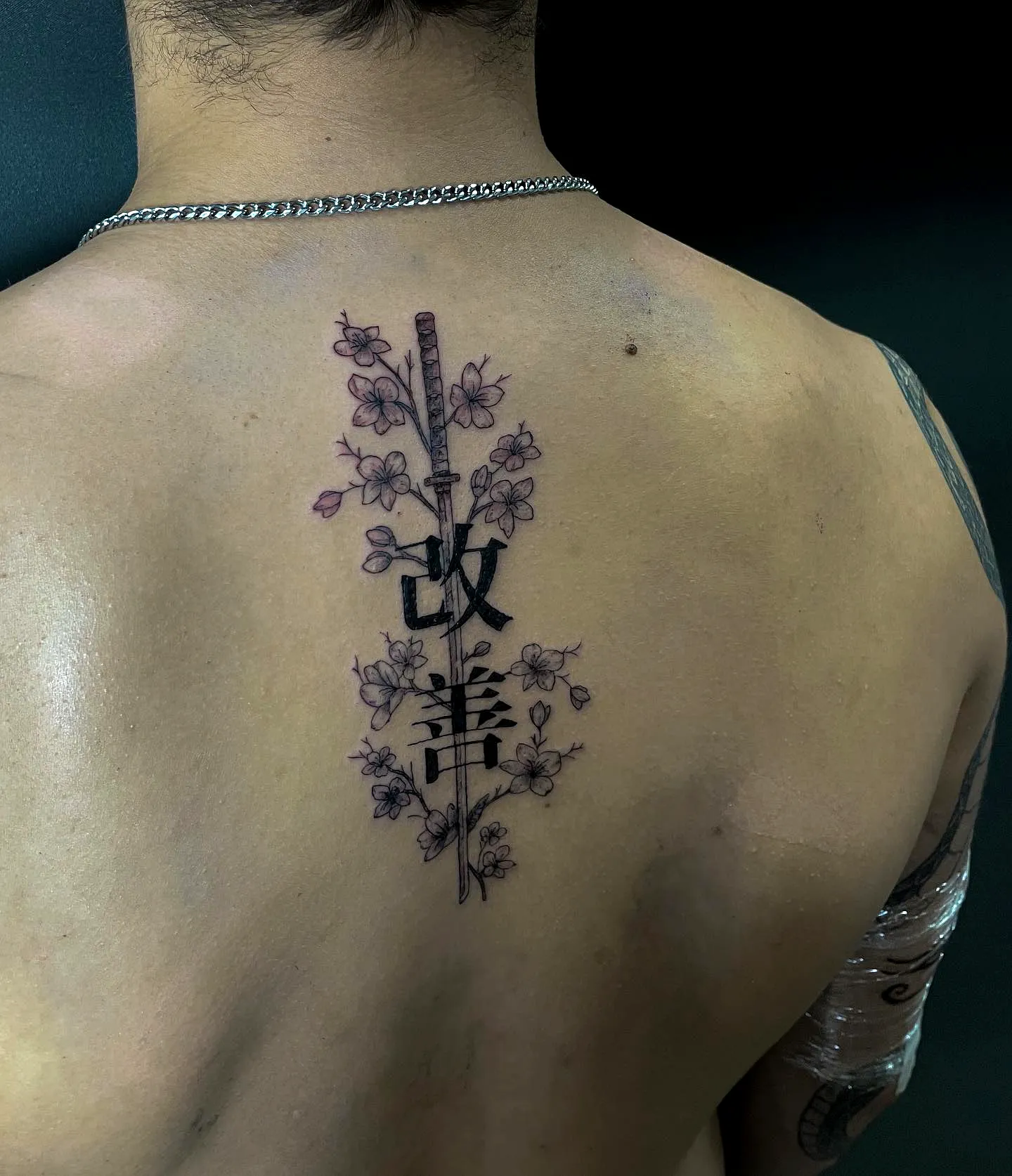 Cherry Blossom Sword Upper Back Tattoo
