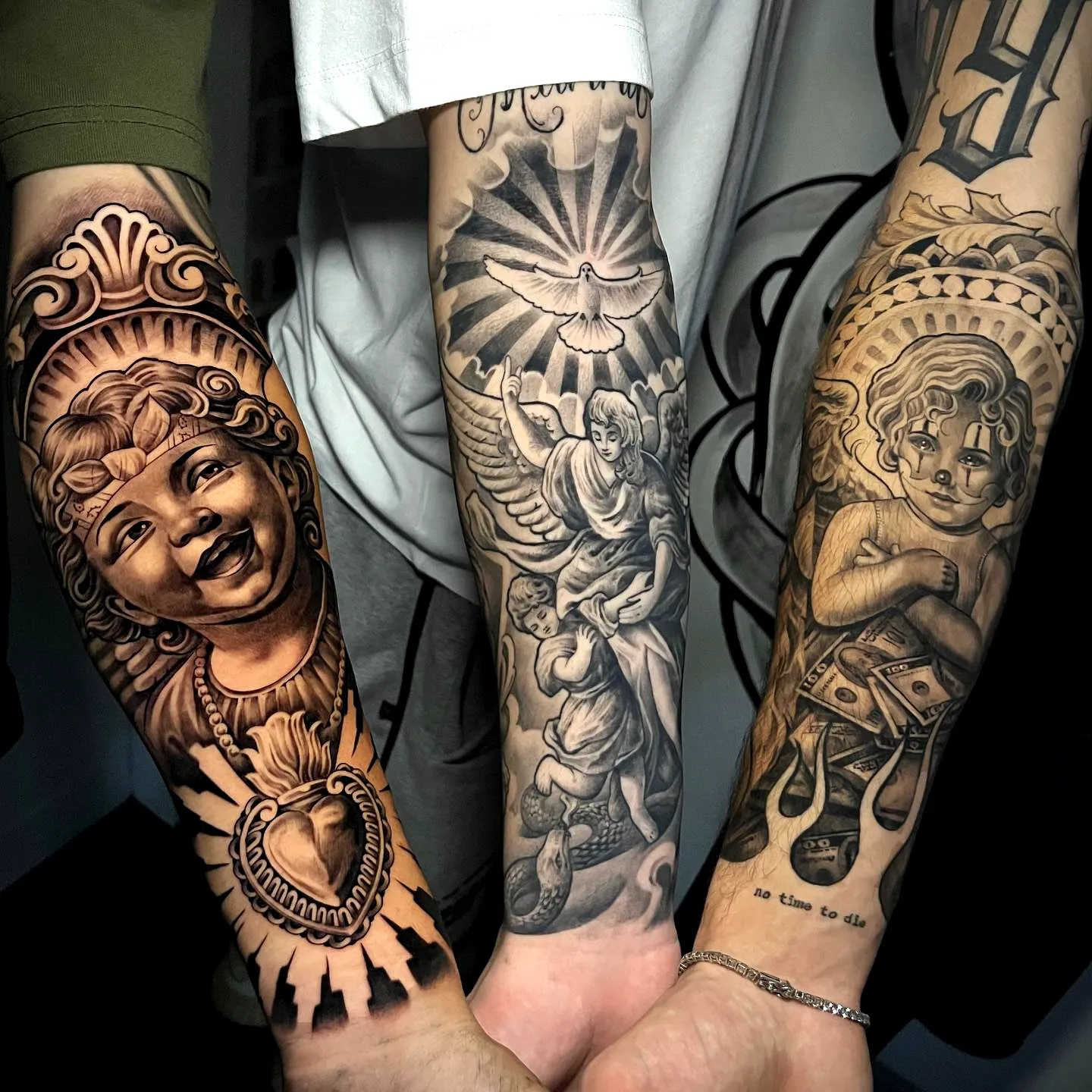 Cherubic Sleeve Arm Tattoo in Grayscale