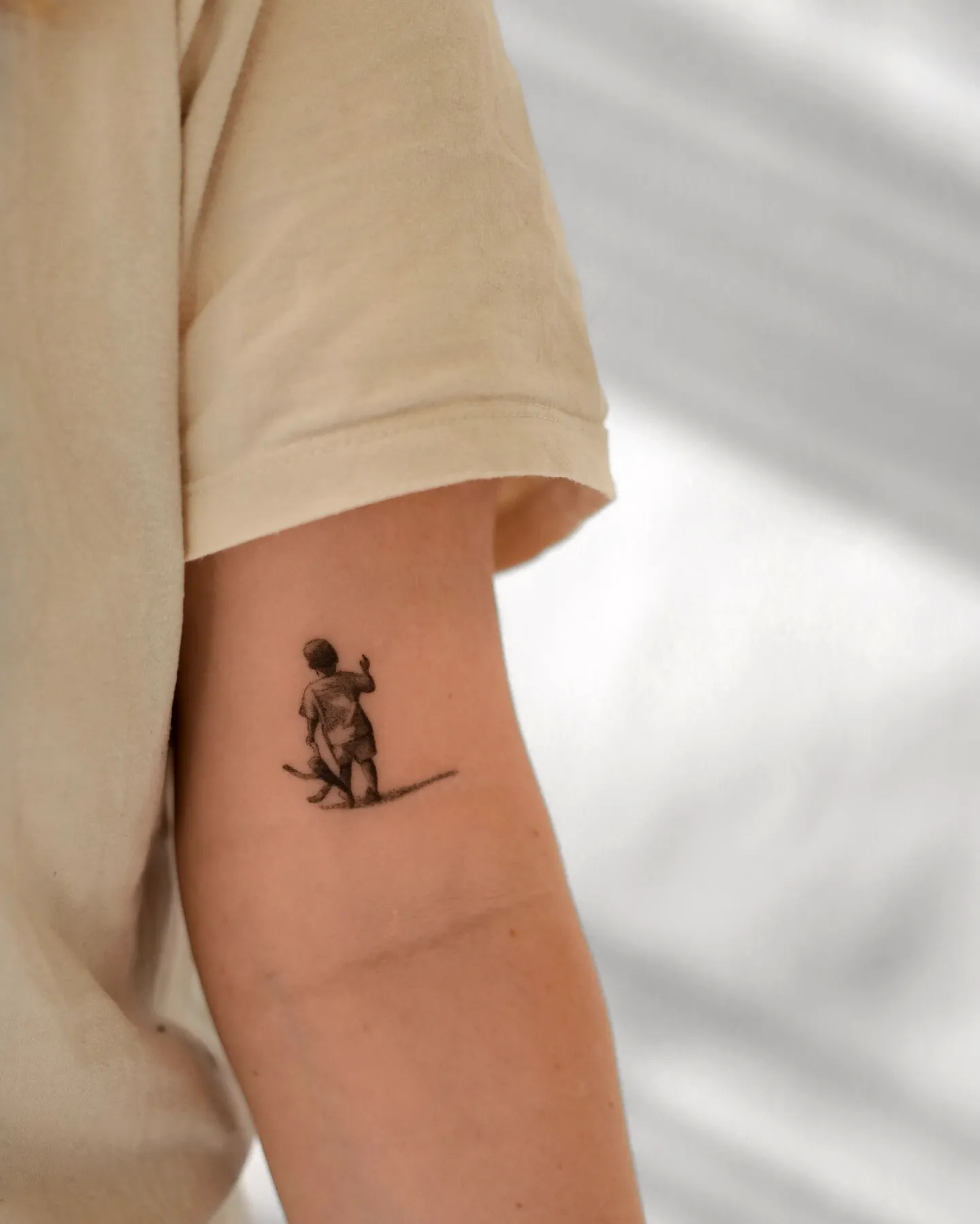 Child Elbow Tattoo in Monochrome