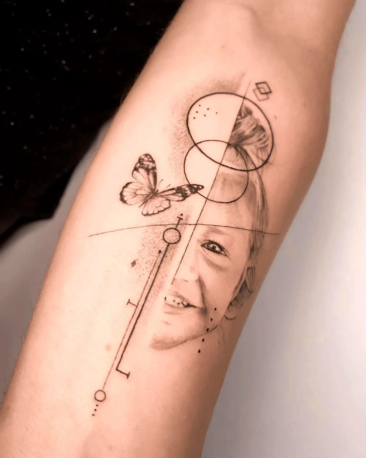 Childs Face Butterfly Arm Tattoo