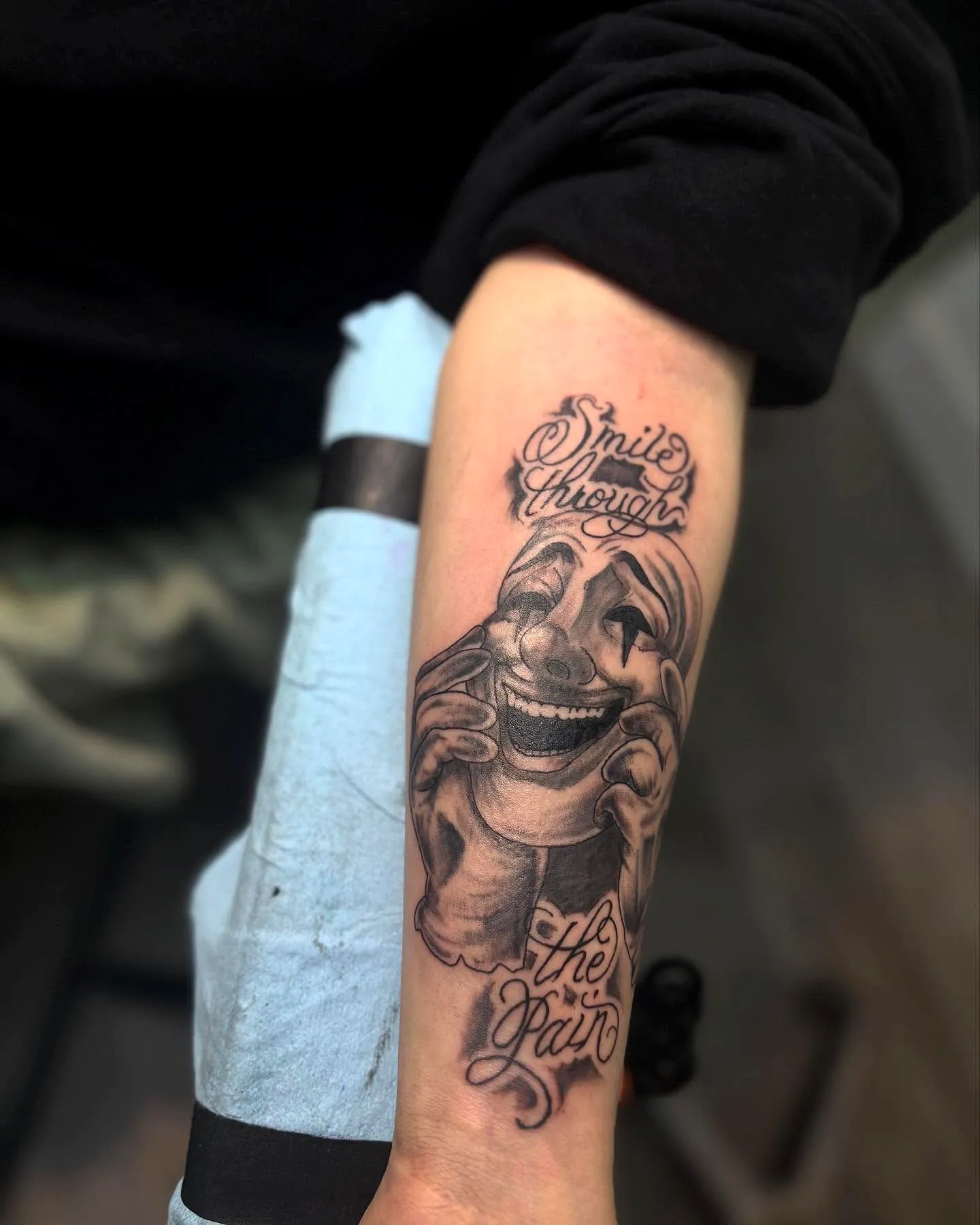 Clown Forearm Tattoo with Hidden Pain