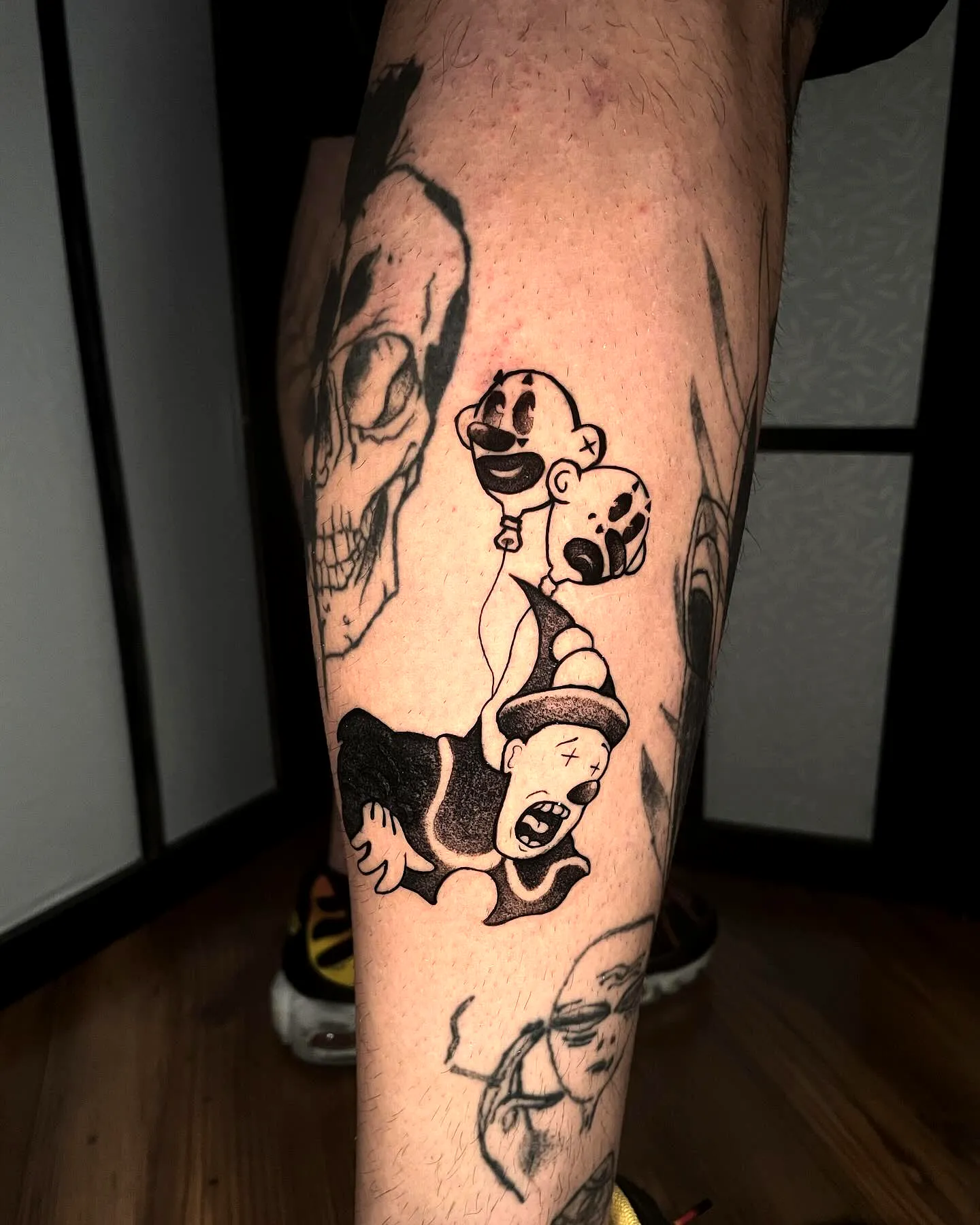 Clown Leg Tattoo with Balloons Design