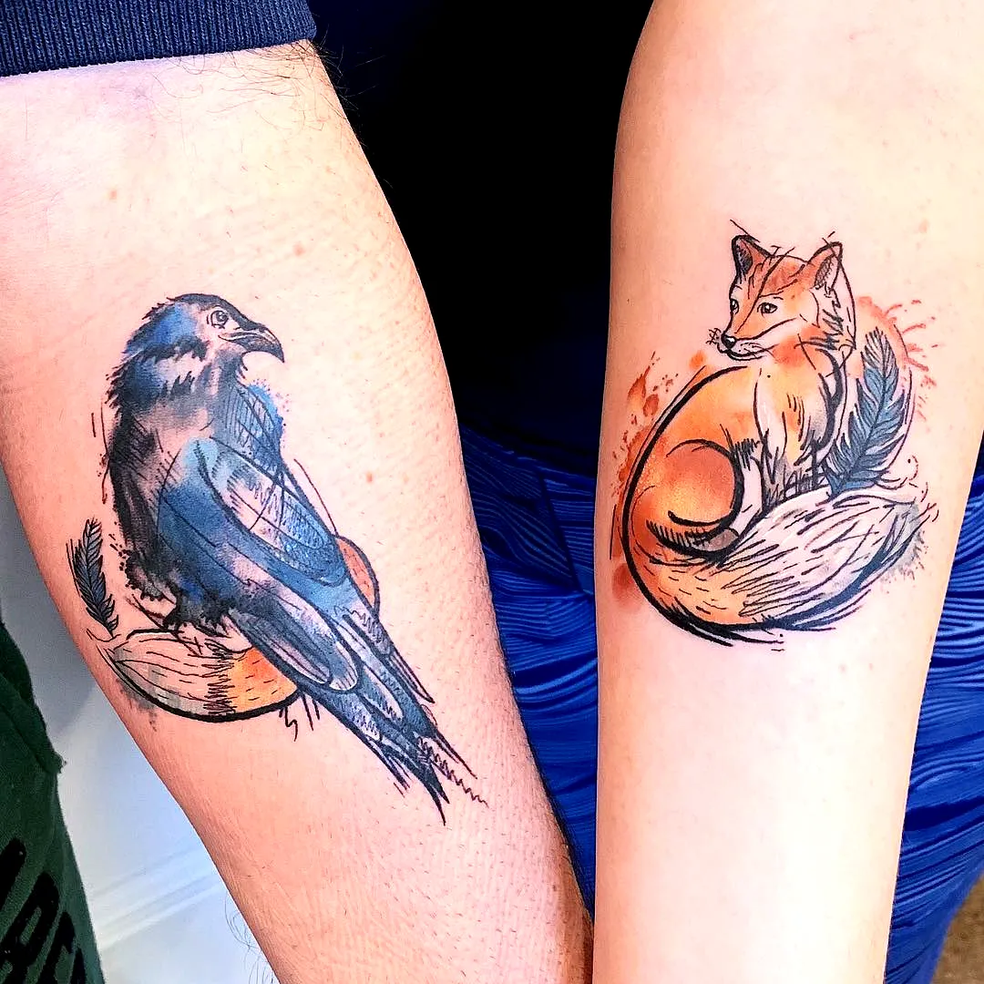 Colorful Fox and Blue Crow Forearm Tattoos