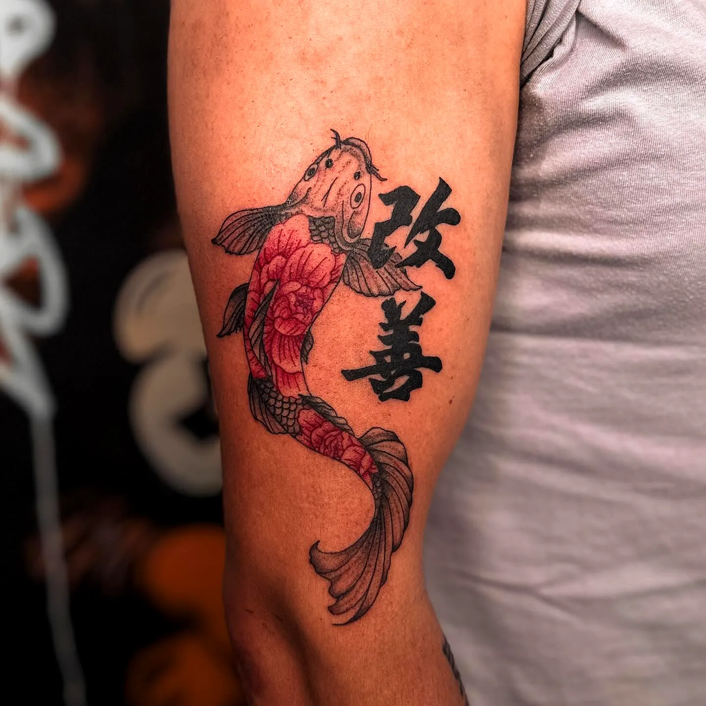 Colorful Koi Fish Upper Arm Tattoo