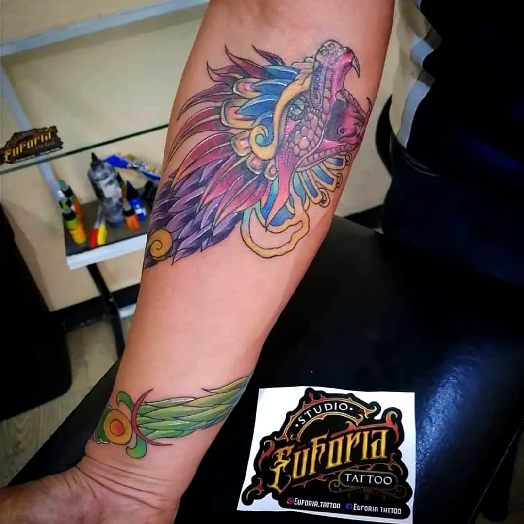 Colorful Lion Forearm Tattoo with Feather