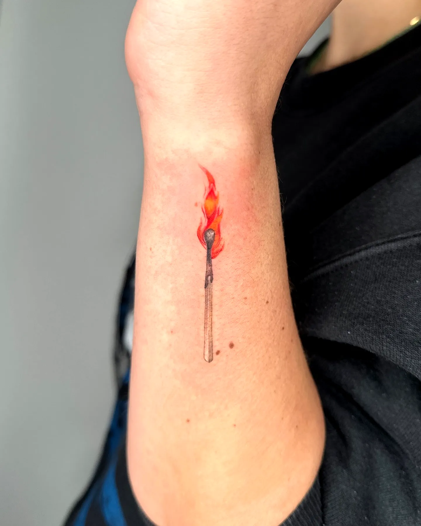 Colorful Matchstick Forearm Tattoo