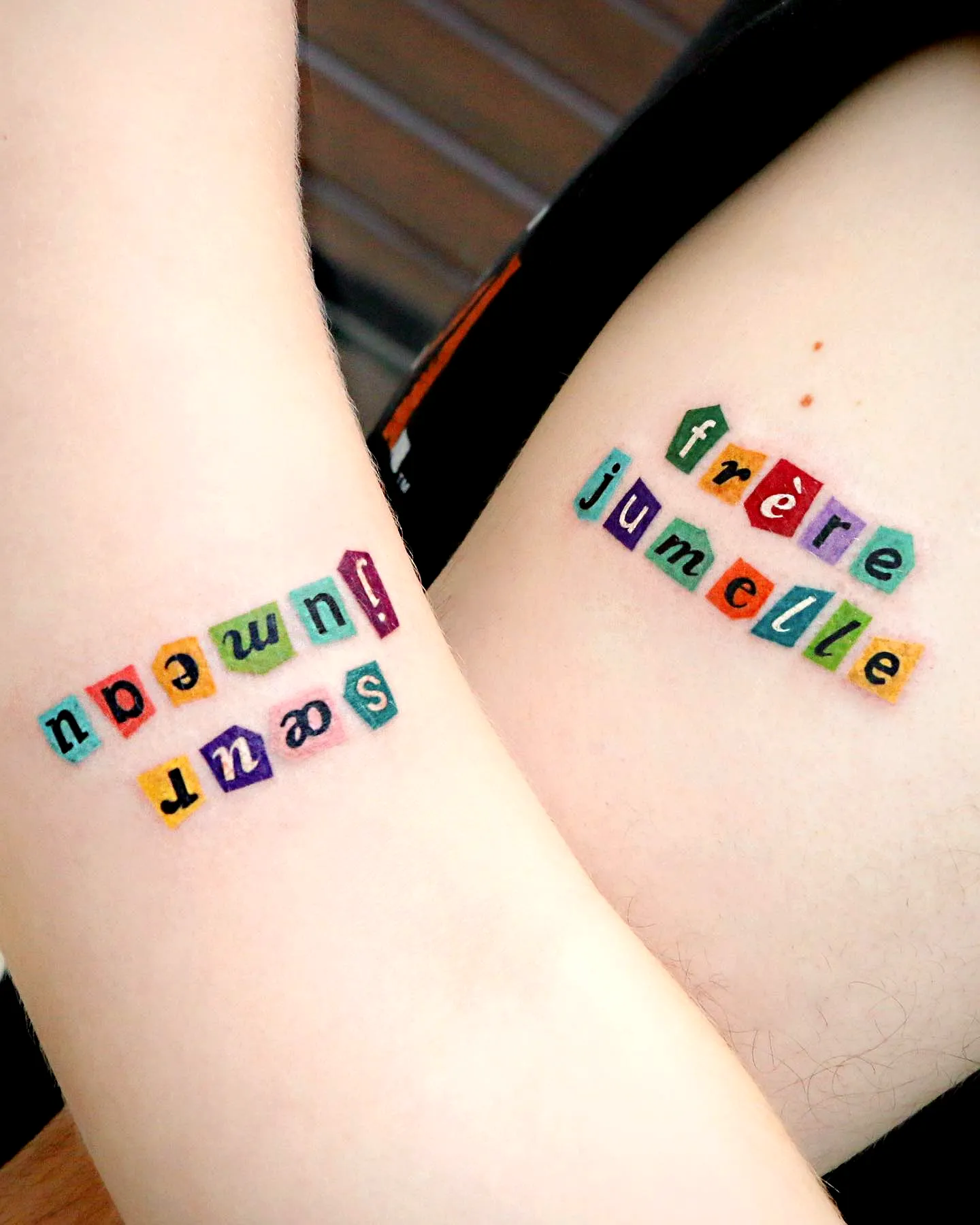 Colorful Twins Inner Arm Tattoo