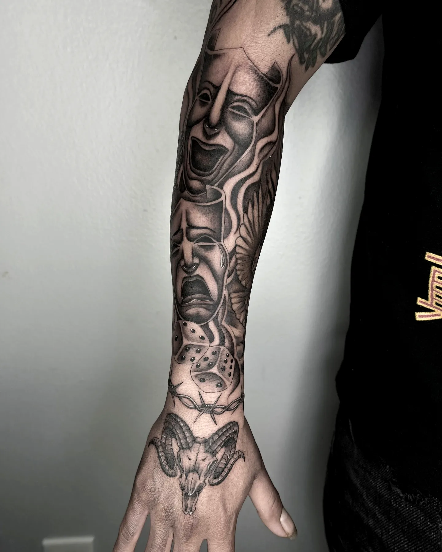 Comedy and Tragedy Forearm Tattoo