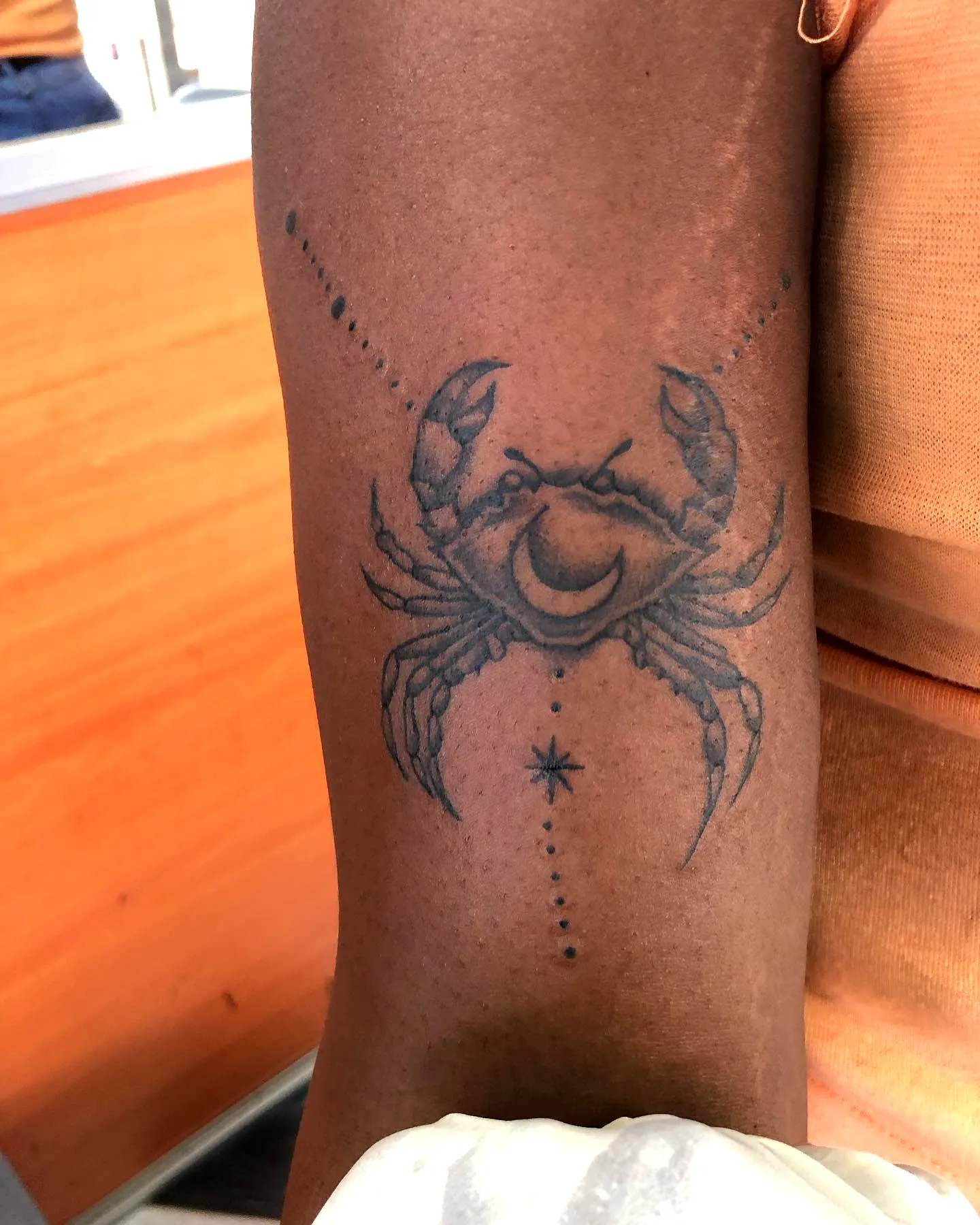 Crab Outer Arm Tattoo with Celestial Elements