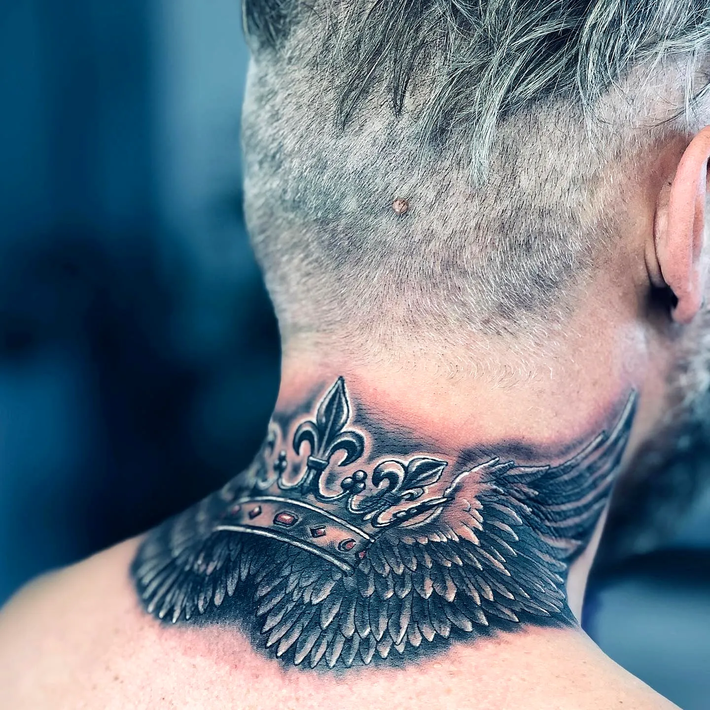 Crown with Wings Neck Tattoo in Black and Gray