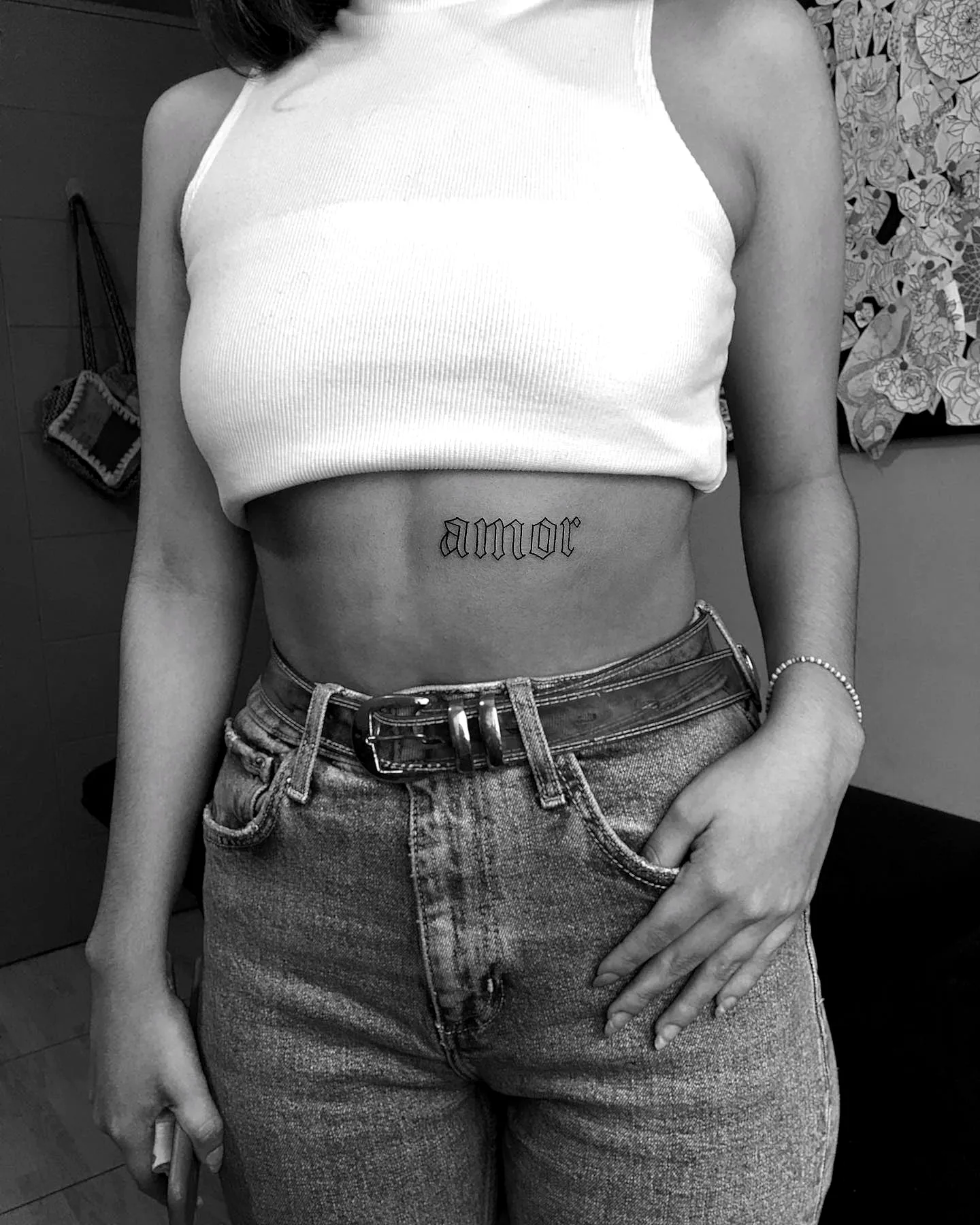 Cursive amor Rib Tattoo in Black Ink