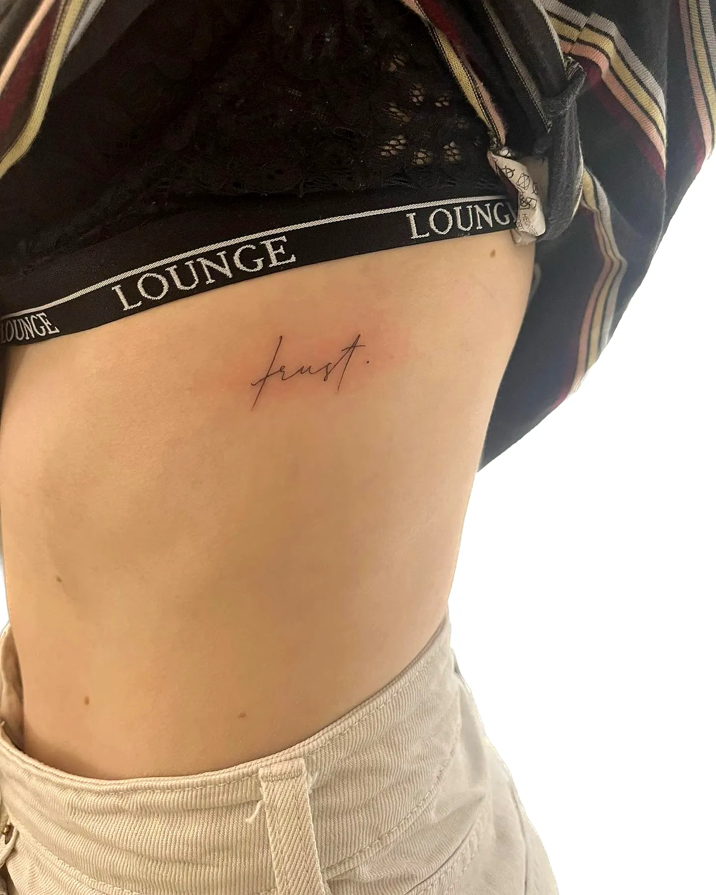 Cursive Red First Tattoo on Torso