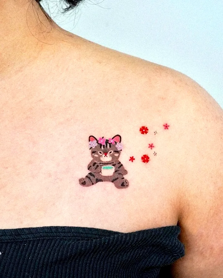Cute Cat Upper Arm Tattoo with Flowers