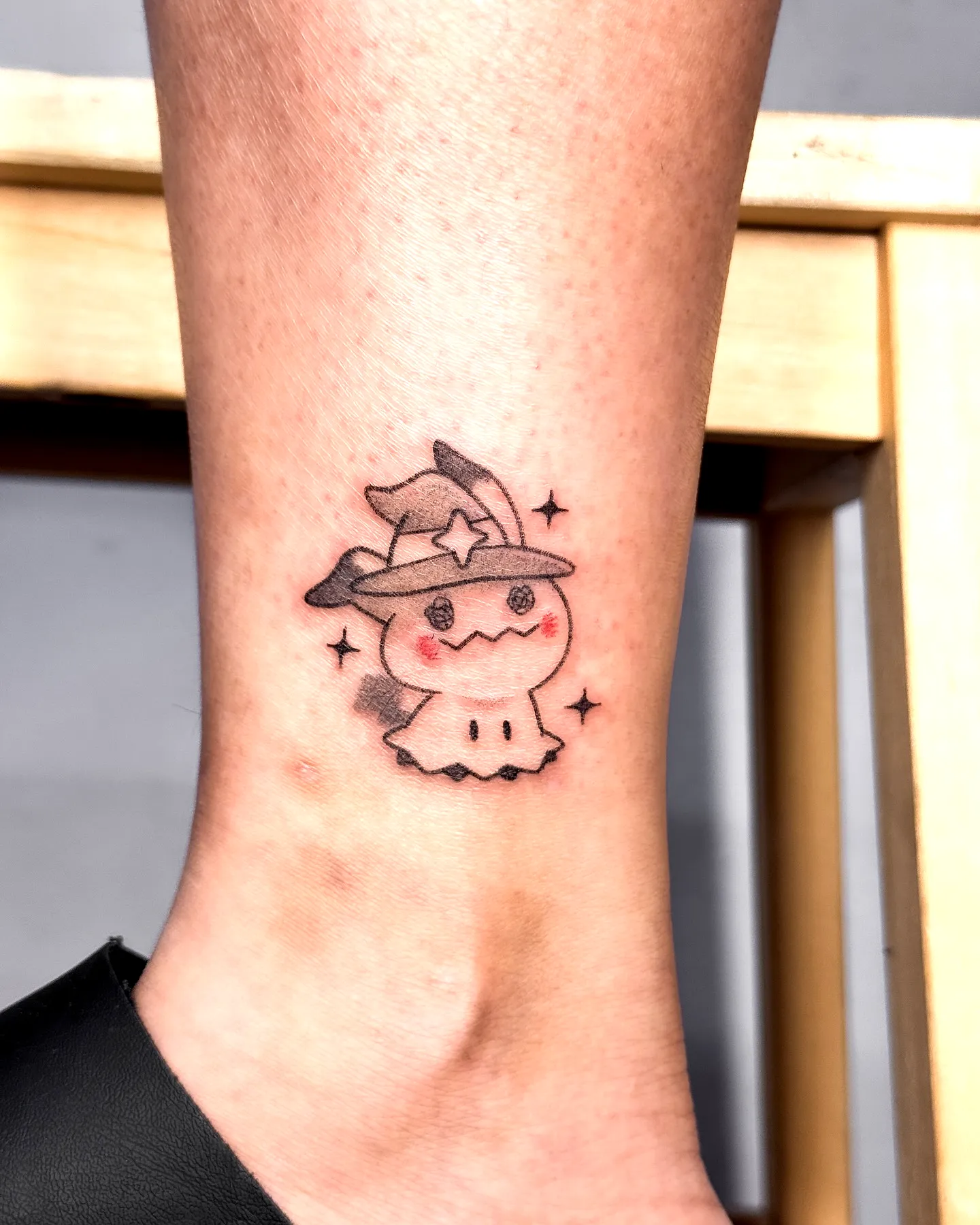 Cute Ghost Ankle Tattoo with Stars