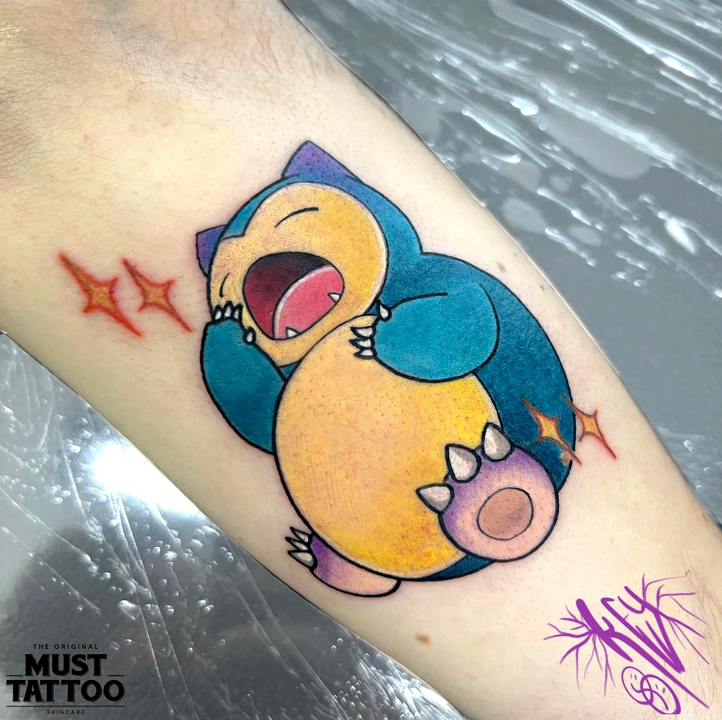 Cute Snorlax Arm Tattoo with Sparkles