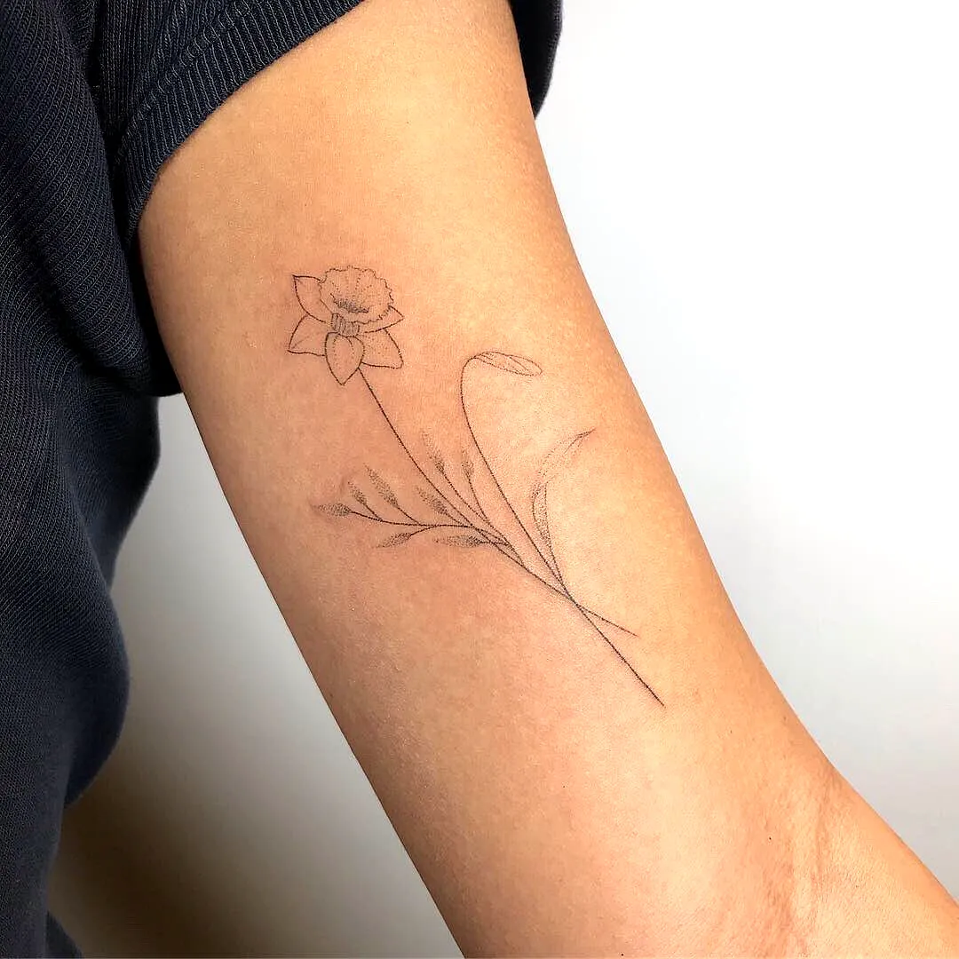 Dainty Daffodil Upper Arm Tattoo